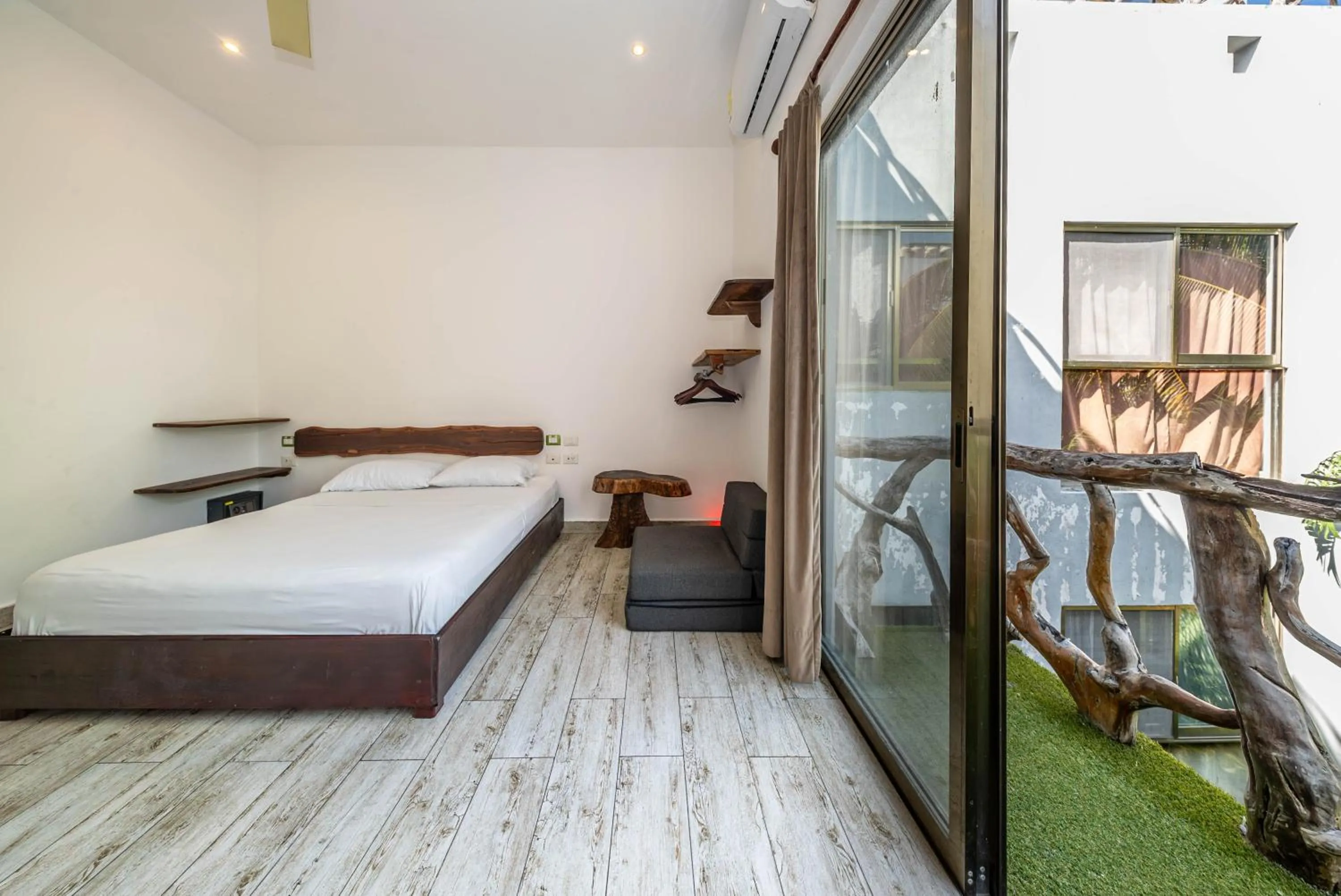 Bed in The Green Village Boutique Hotel