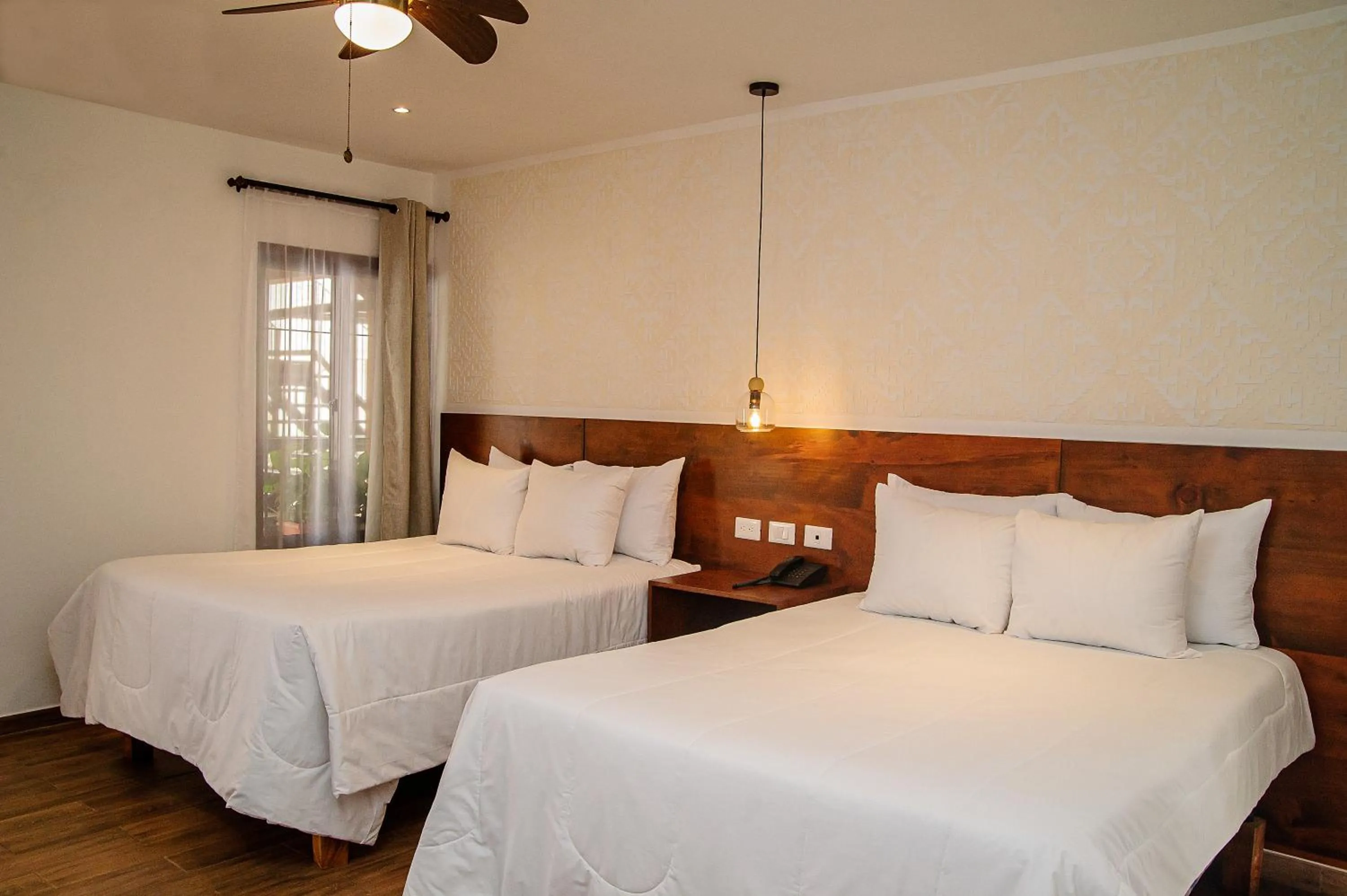 Bed in Hotel Las Camelias Inn by AHS