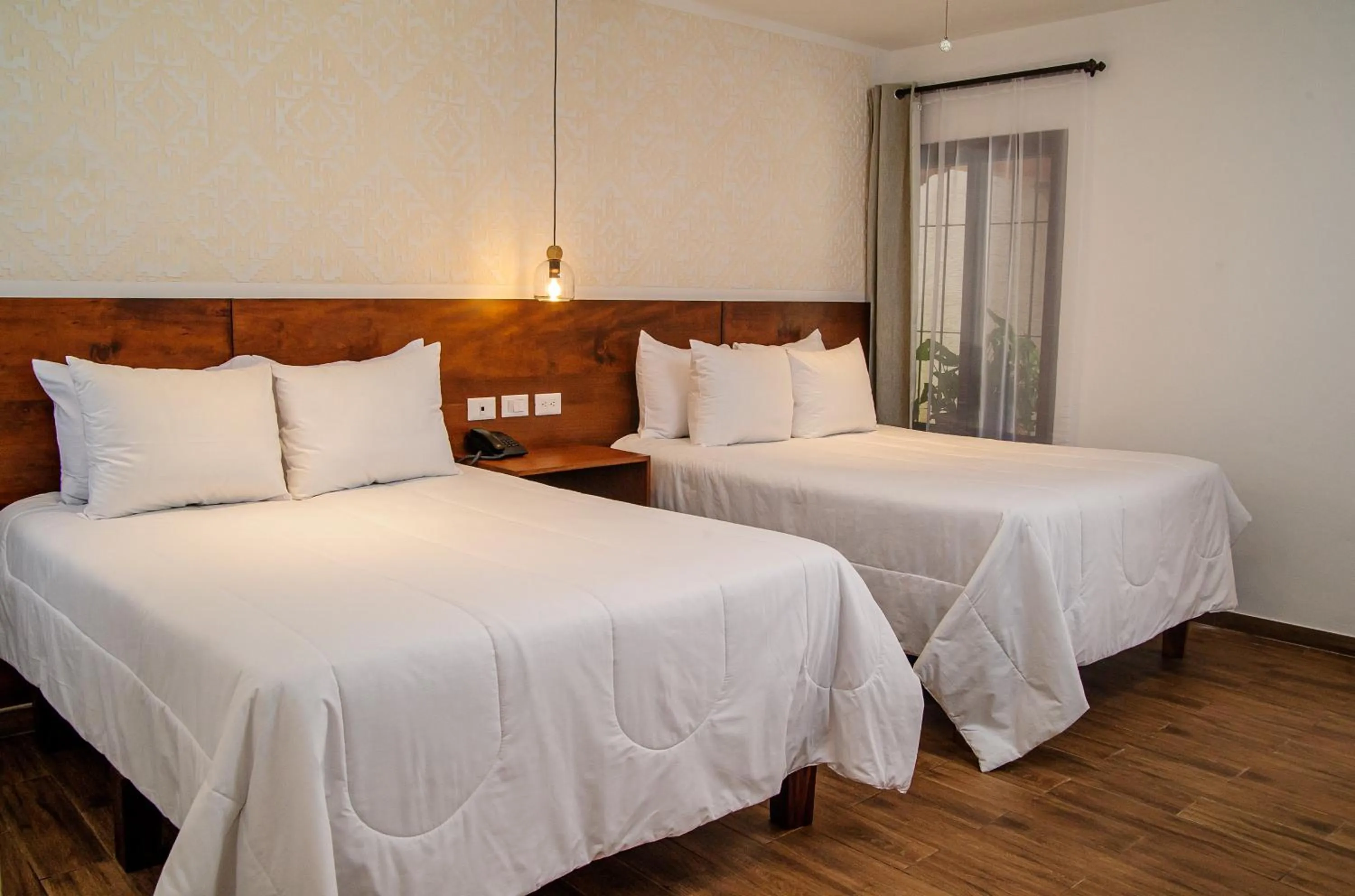 Bed in Hotel Las Camelias Inn by AHS