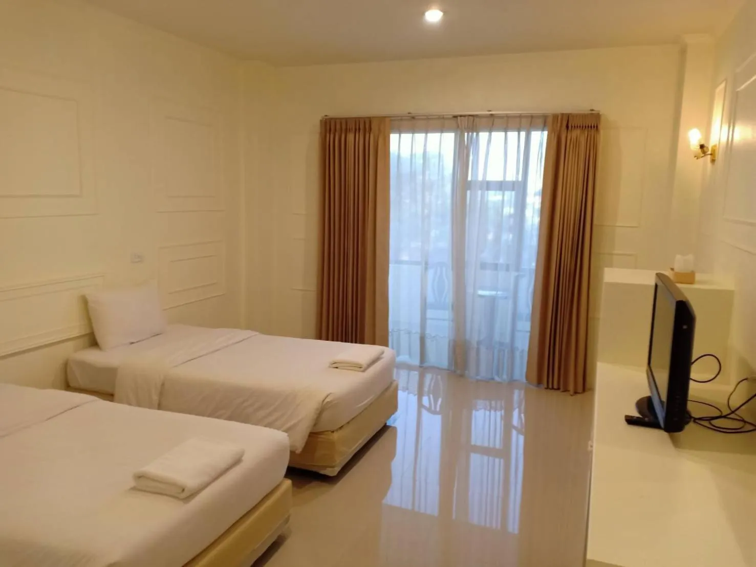 Bed in Golden Dragon Resort