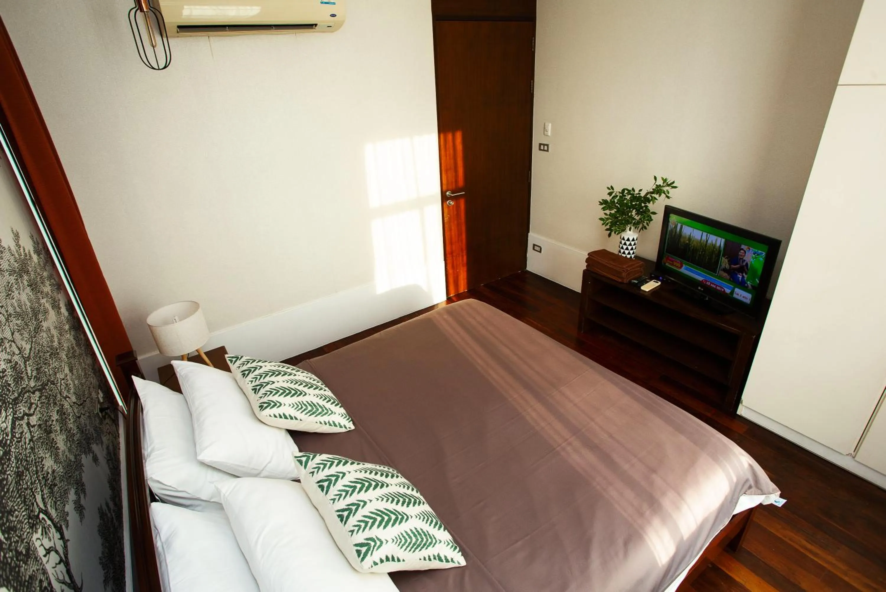 Bed in Nagawari Art Maldives BBQ Pattaya Villa