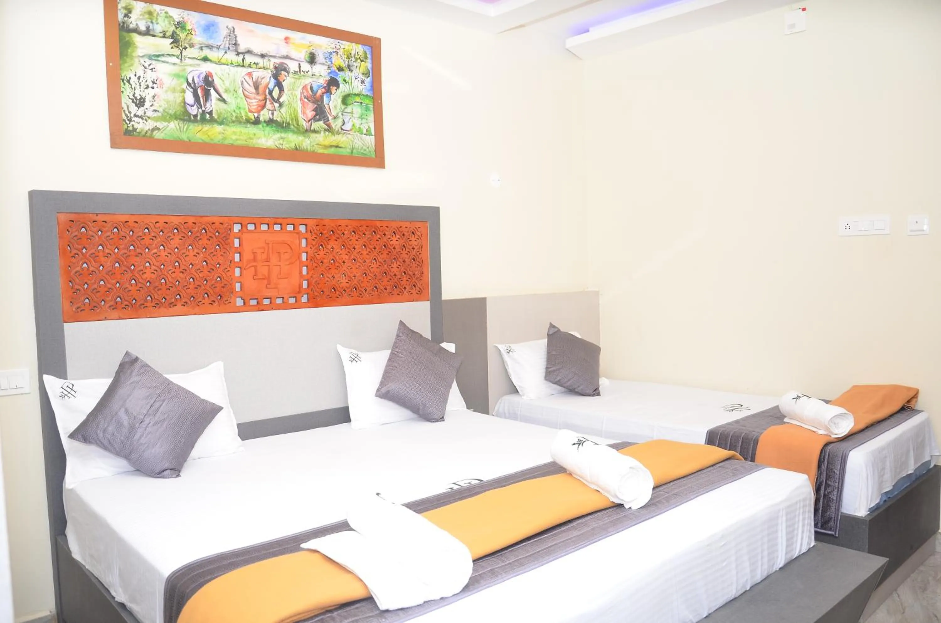 Bed in HOTEL PANCHAVARNAA