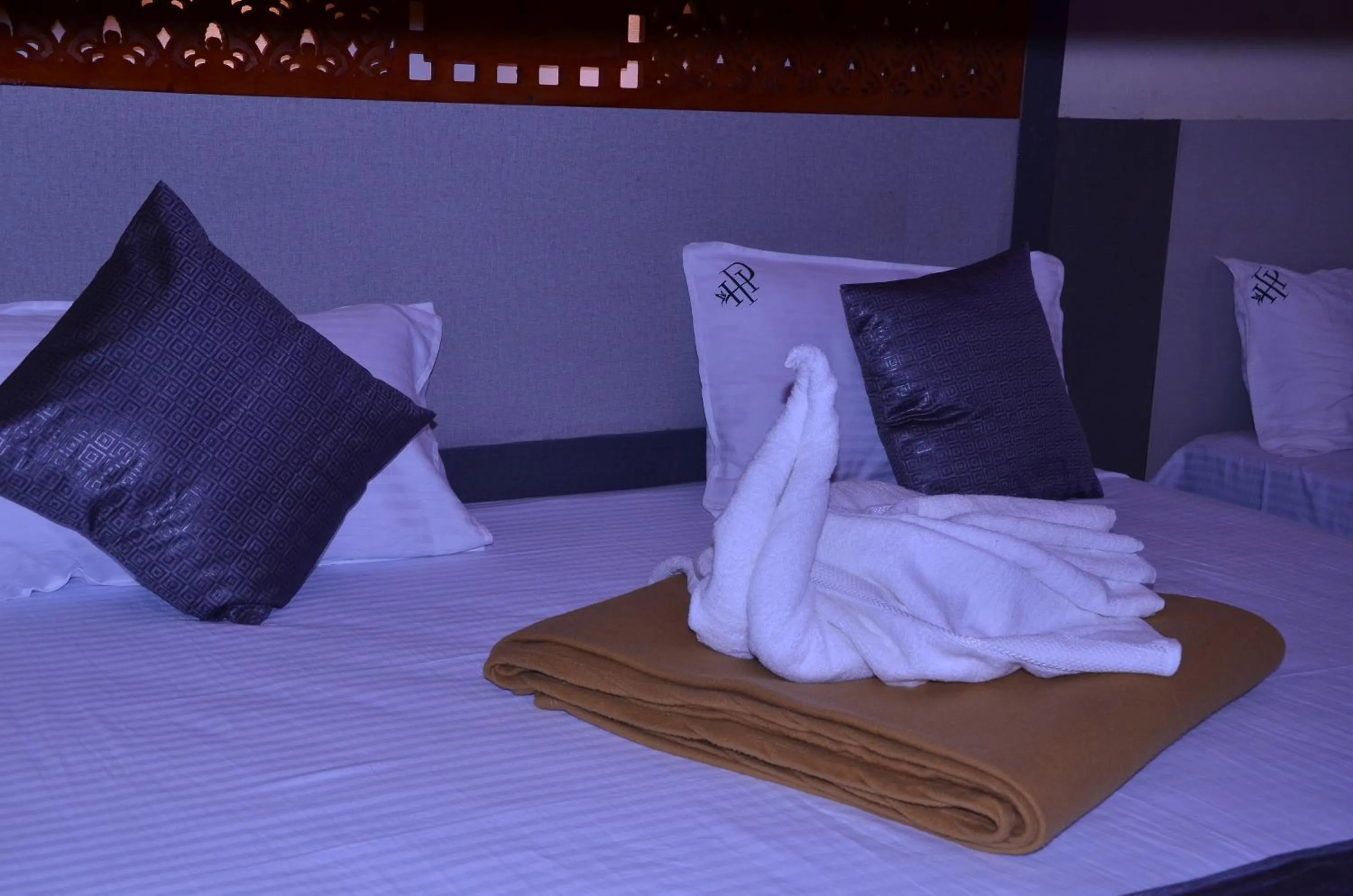 Bed in HOTEL PANCHAVARNAA