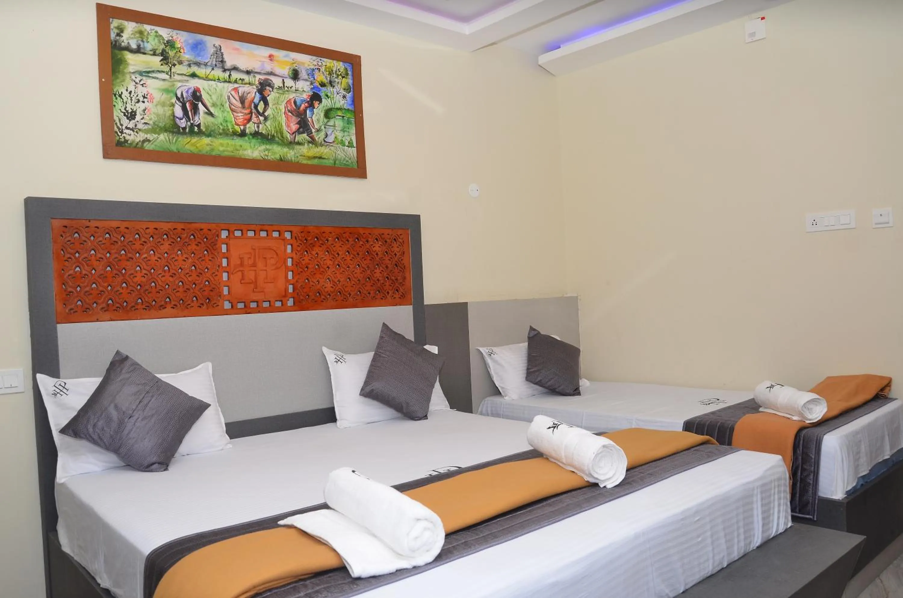 Bed in HOTEL PANCHAVARNAA