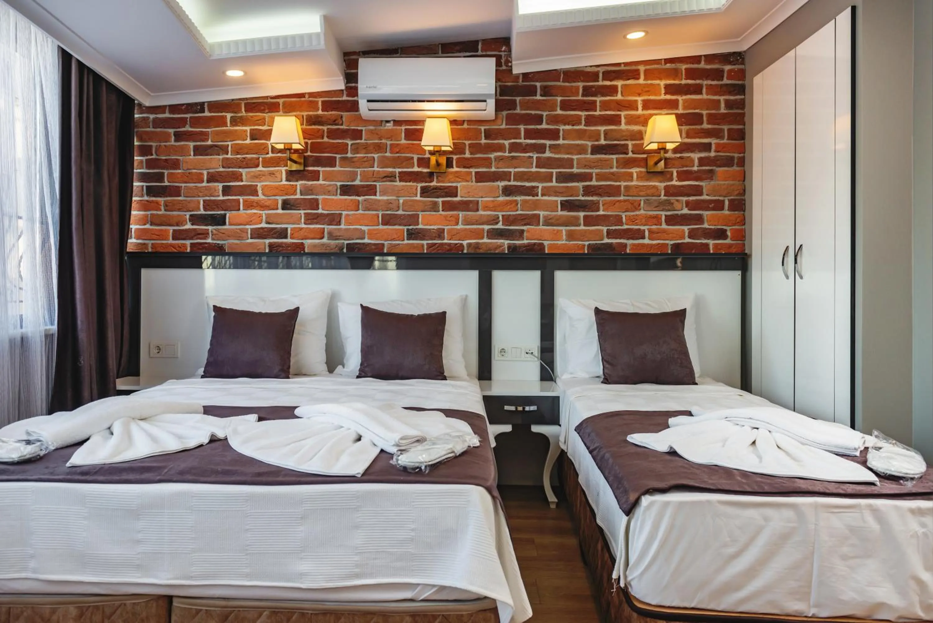 Bed in Gloria Suites Old City