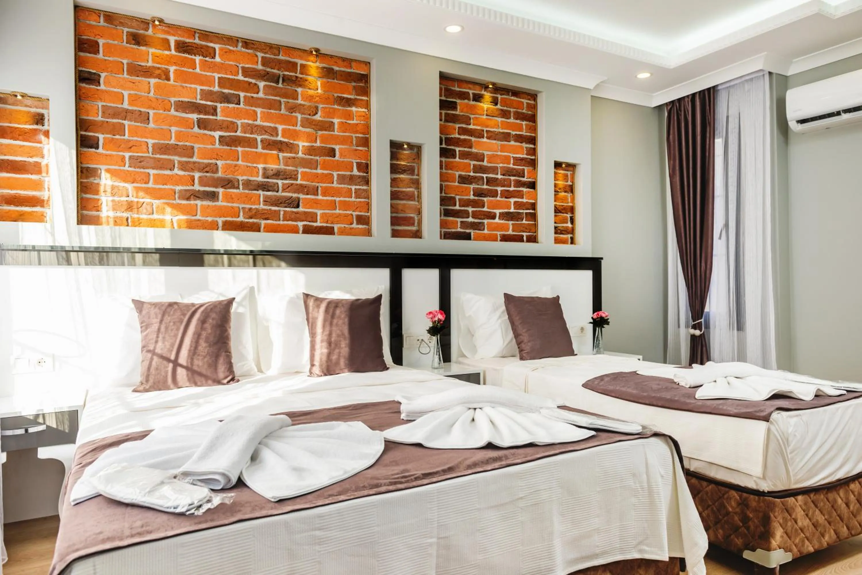 Bed in Gloria Suites Old City