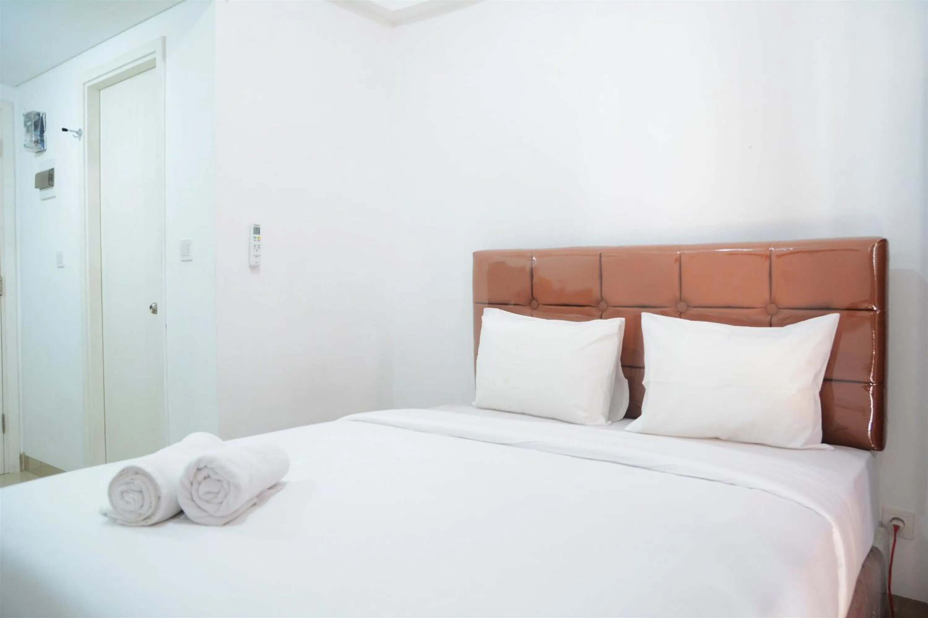 Bed in Comfy Studio Poris 88 Apartment By Travelio
