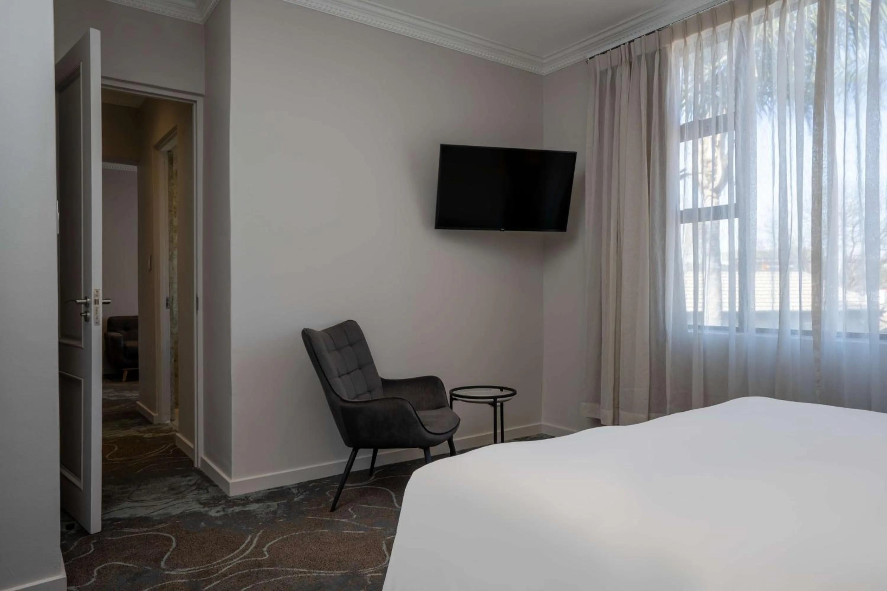 Photo of the whole room, Bed in Radisson Hotel and Convention Centre OR Tambo Airport