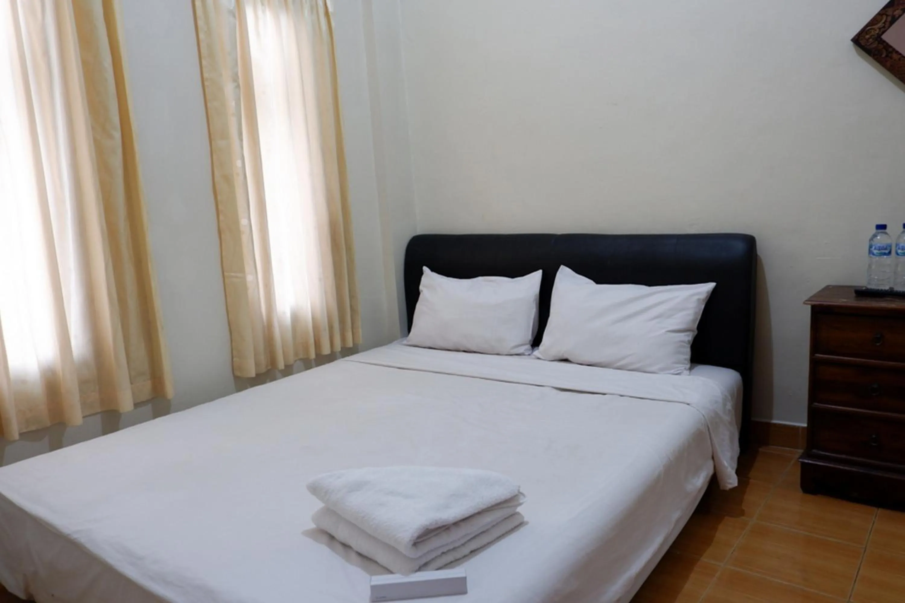 Bed in Khresna Guest House Malioboro Mitra RedDoorz
