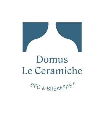 Property logo or sign in Domus Le Ceramiche