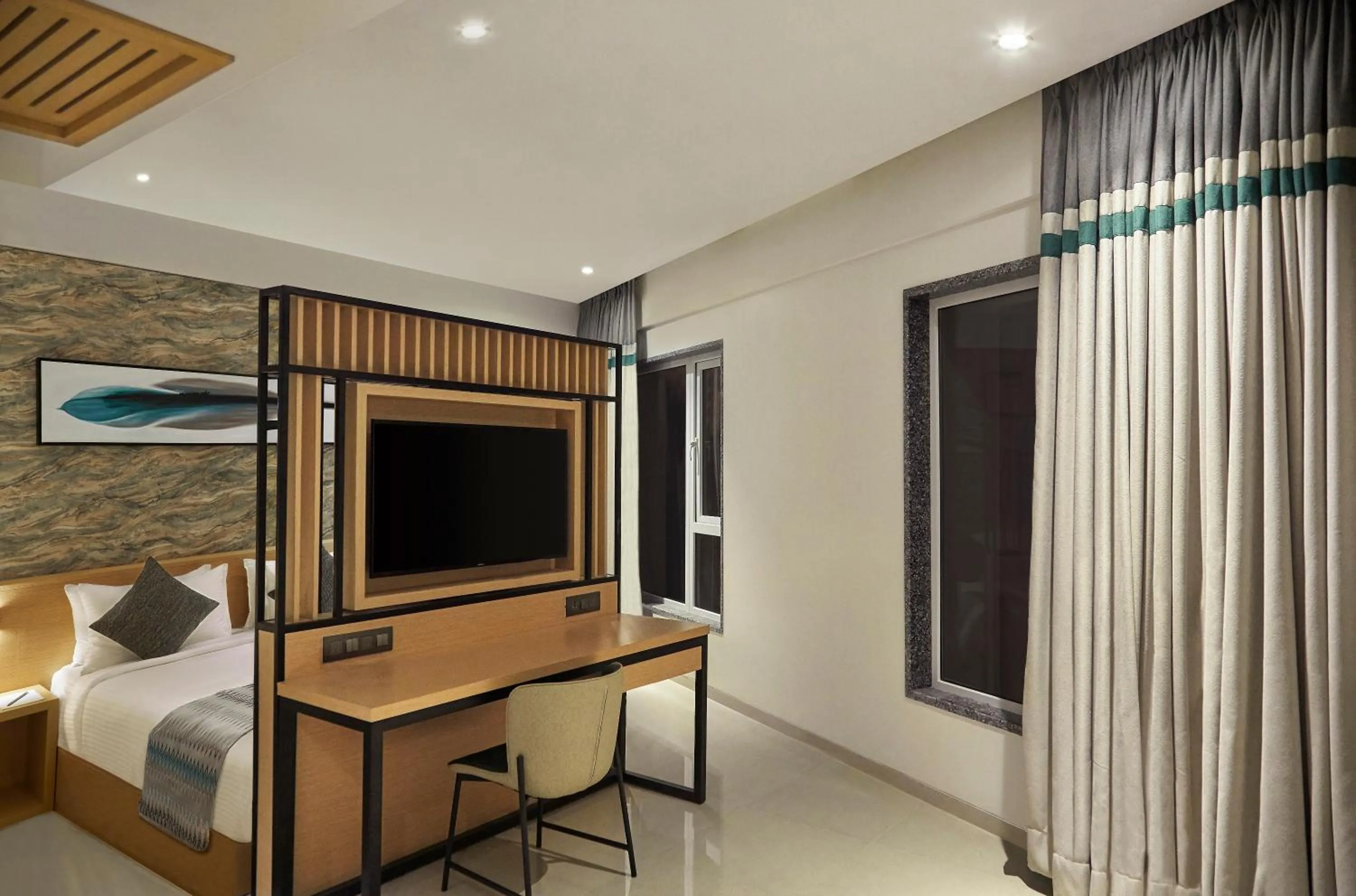 Communal lounge/ TV room, Bed in Click Hotel Bangalore - International Airport
