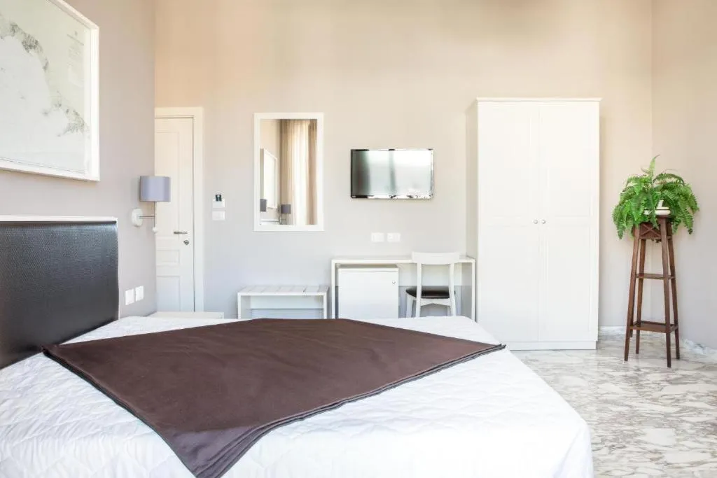 Bed in Faro Bianco Gallipoli Dependance