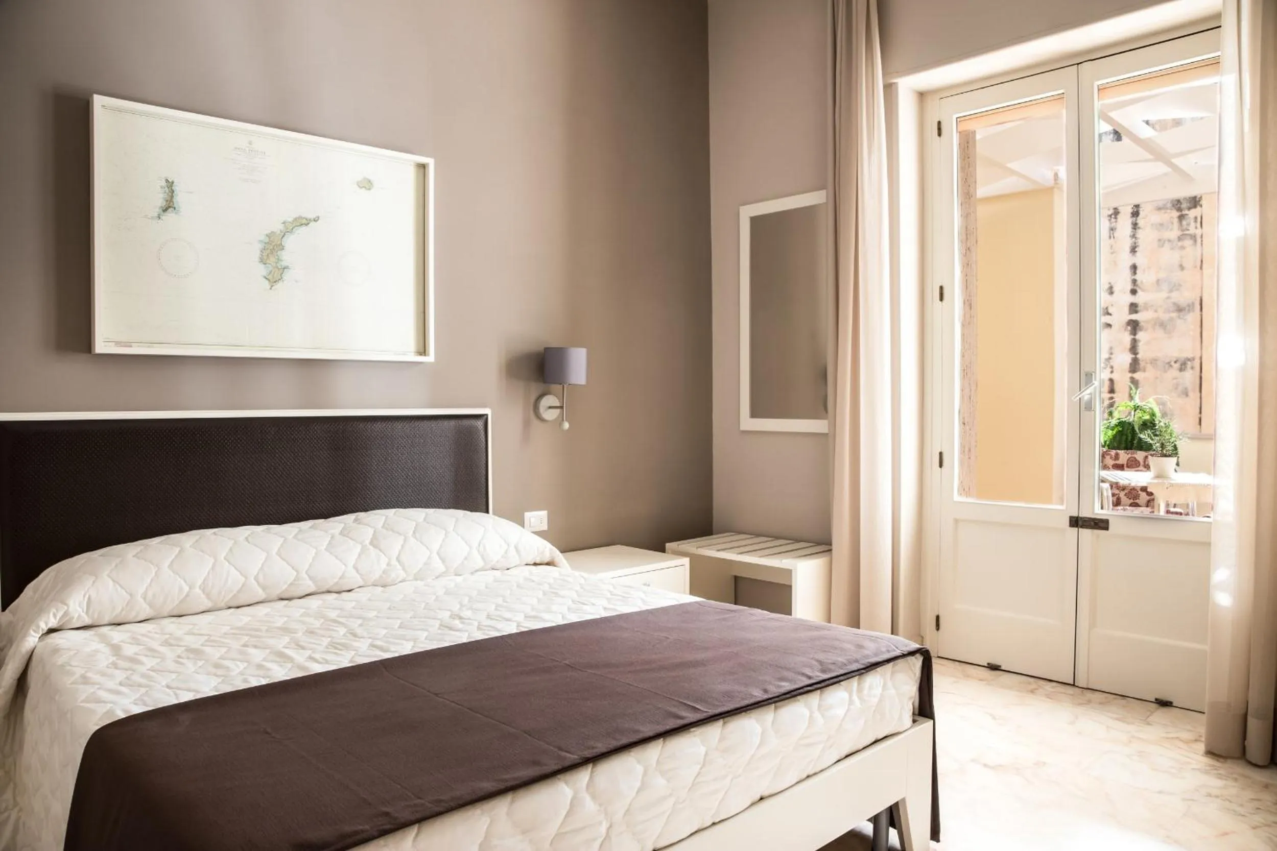 Bed in Faro Bianco Gallipoli Dependance