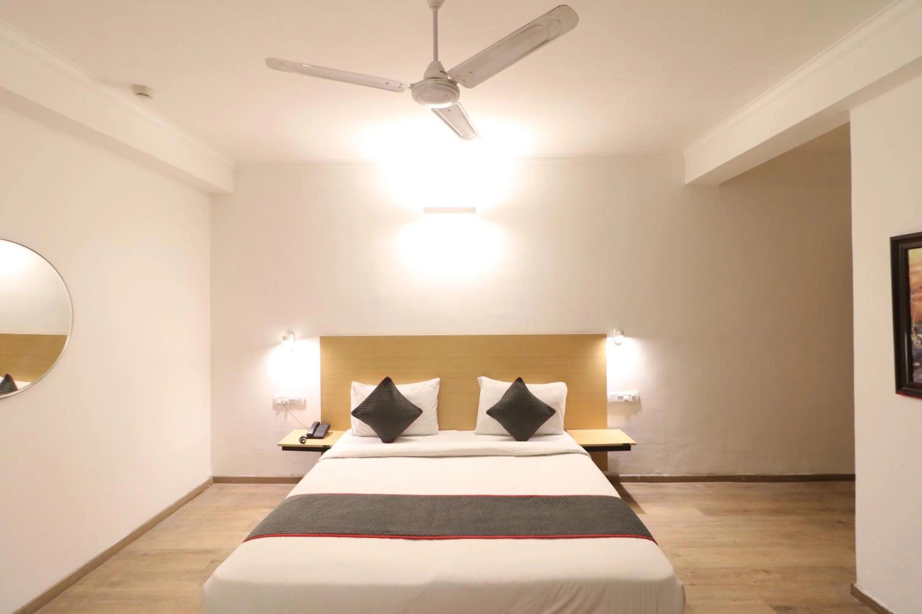 Photo of the whole room, Bed in Flora Residency