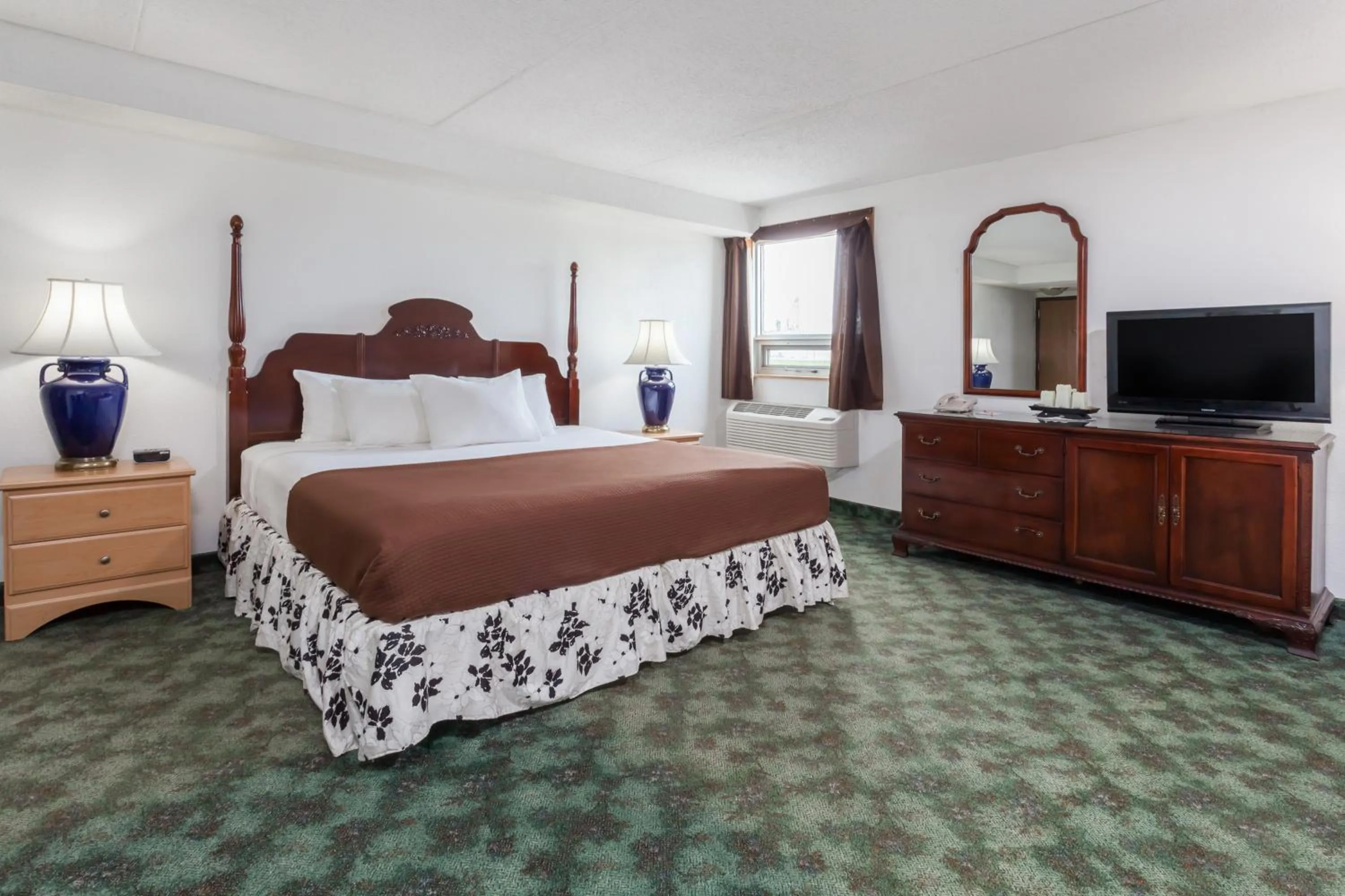 Bathroom in Howard Johnson by Wyndham Melville