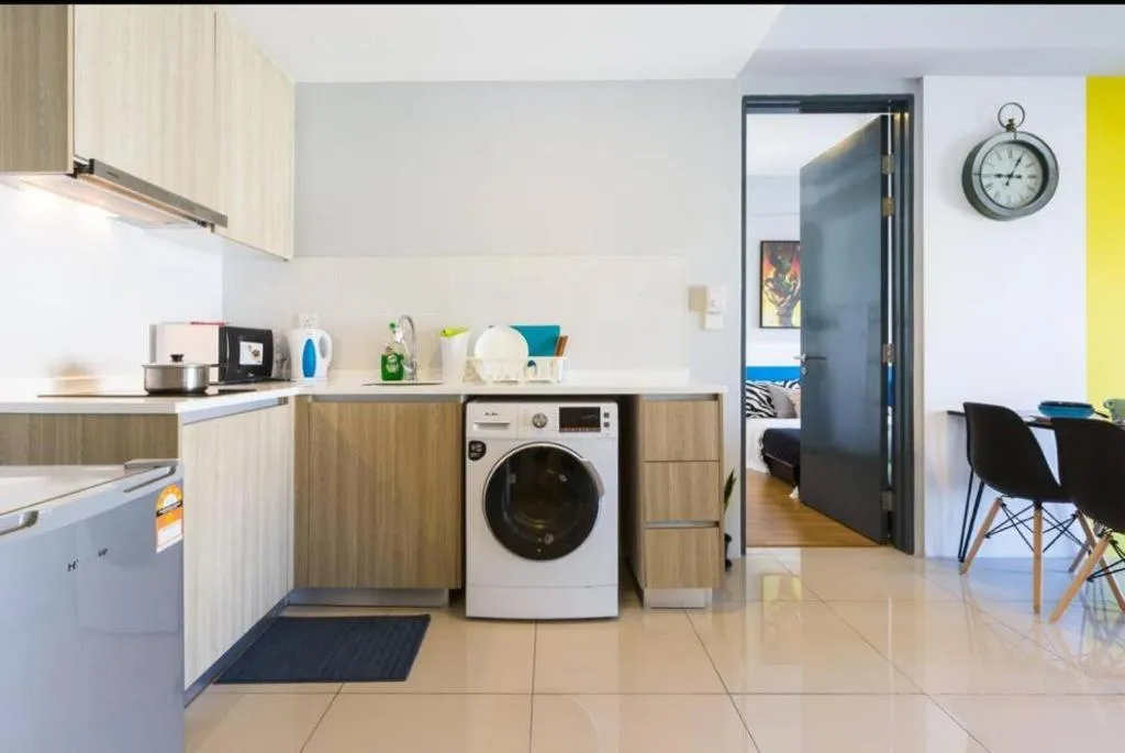 washing machine in Georgetown Tropicana 218 Apartment