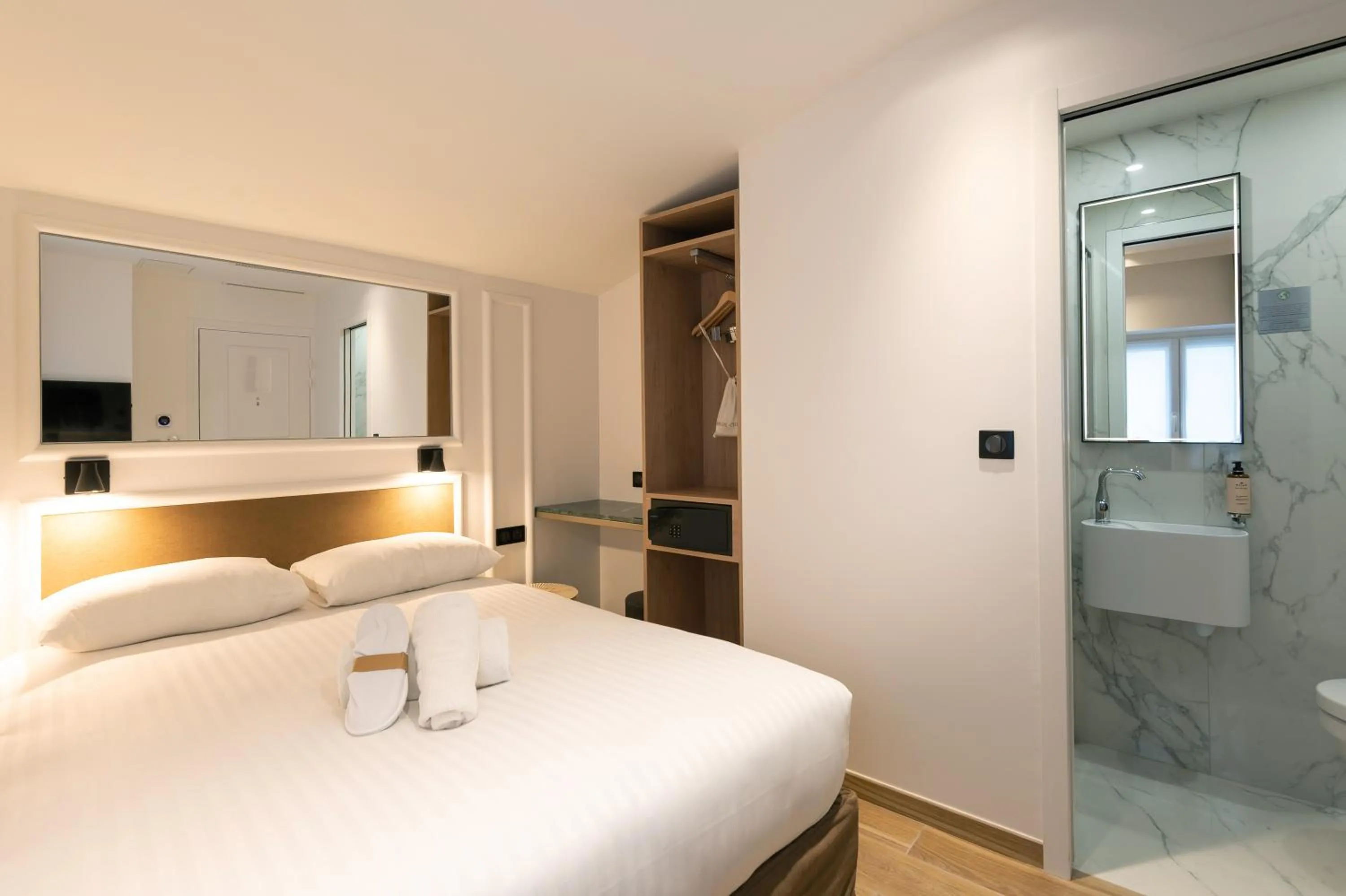 Photo of the whole room, Bed in HOTEL AU COEUR DE REPUBLIQUE