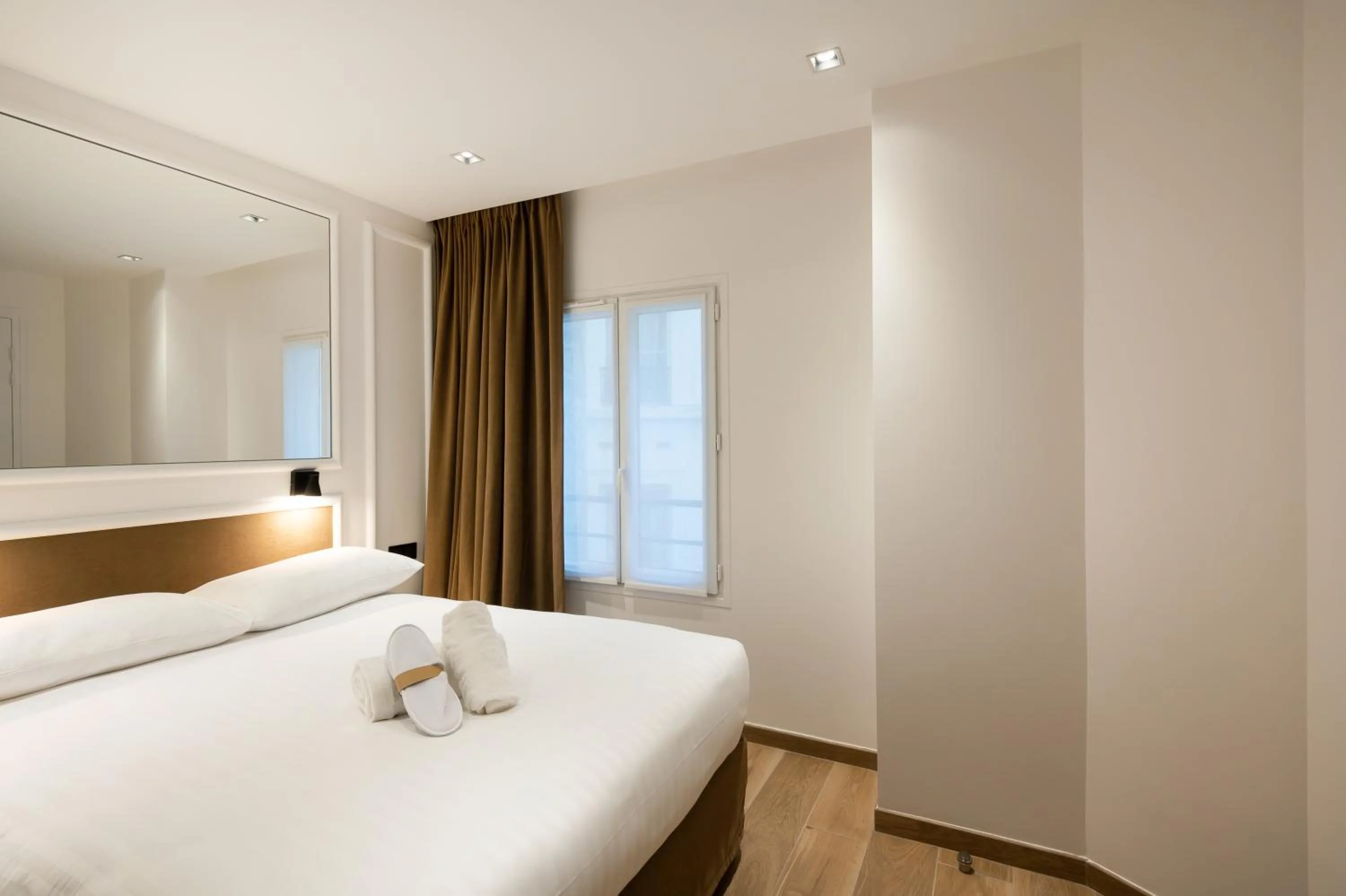 Photo of the whole room, Bed in HOTEL AU COEUR DE REPUBLIQUE