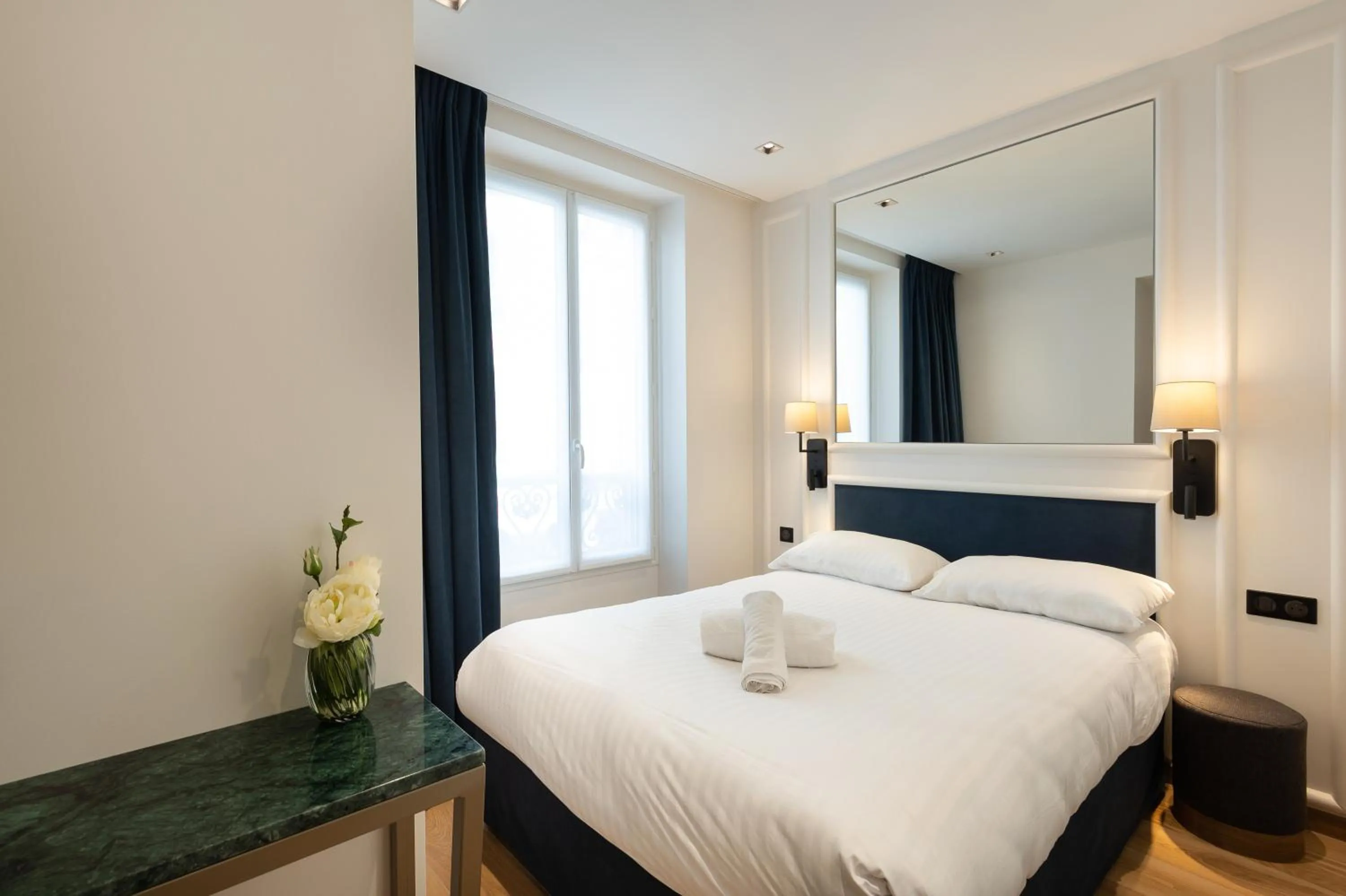 Bed in HOTEL AU COEUR DE REPUBLIQUE