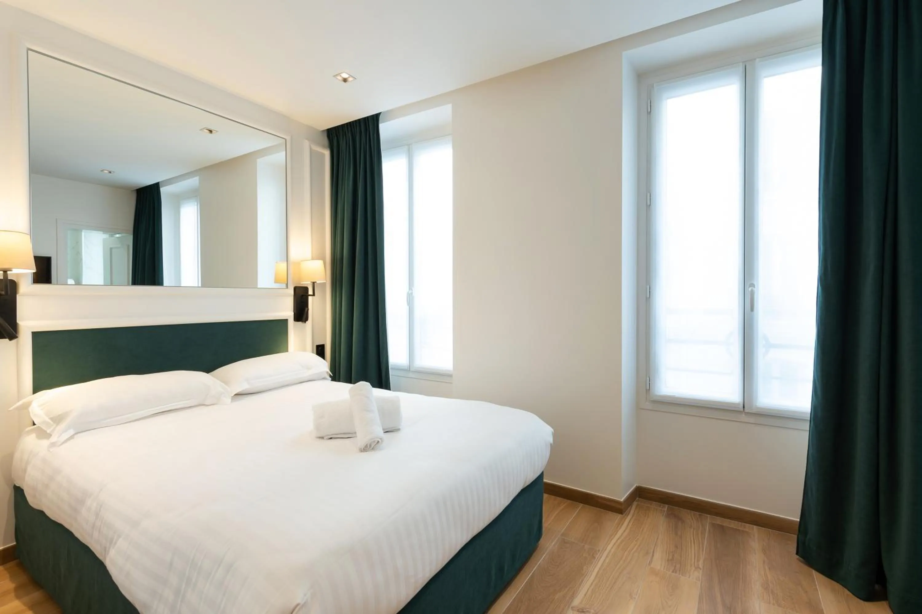 Bed in HOTEL AU COEUR DE REPUBLIQUE