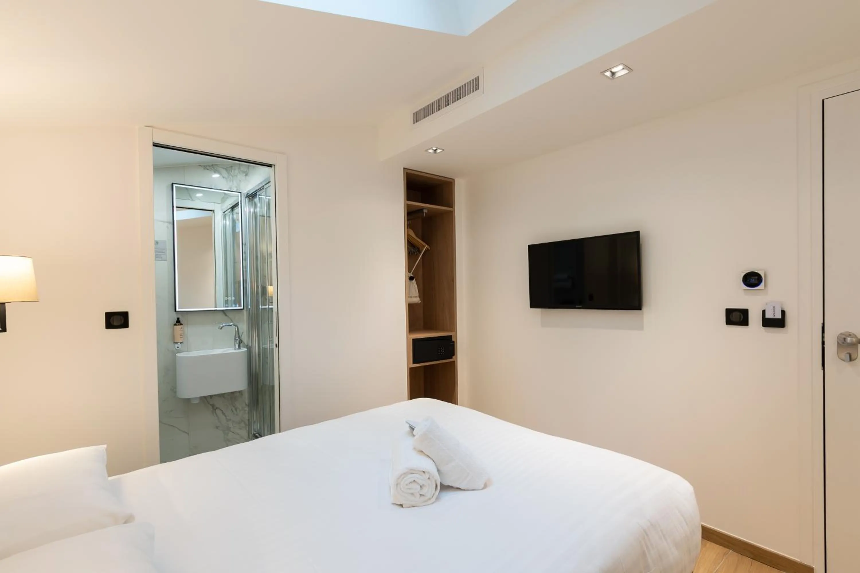 Photo of the whole room, Bed in HOTEL AU COEUR DE REPUBLIQUE