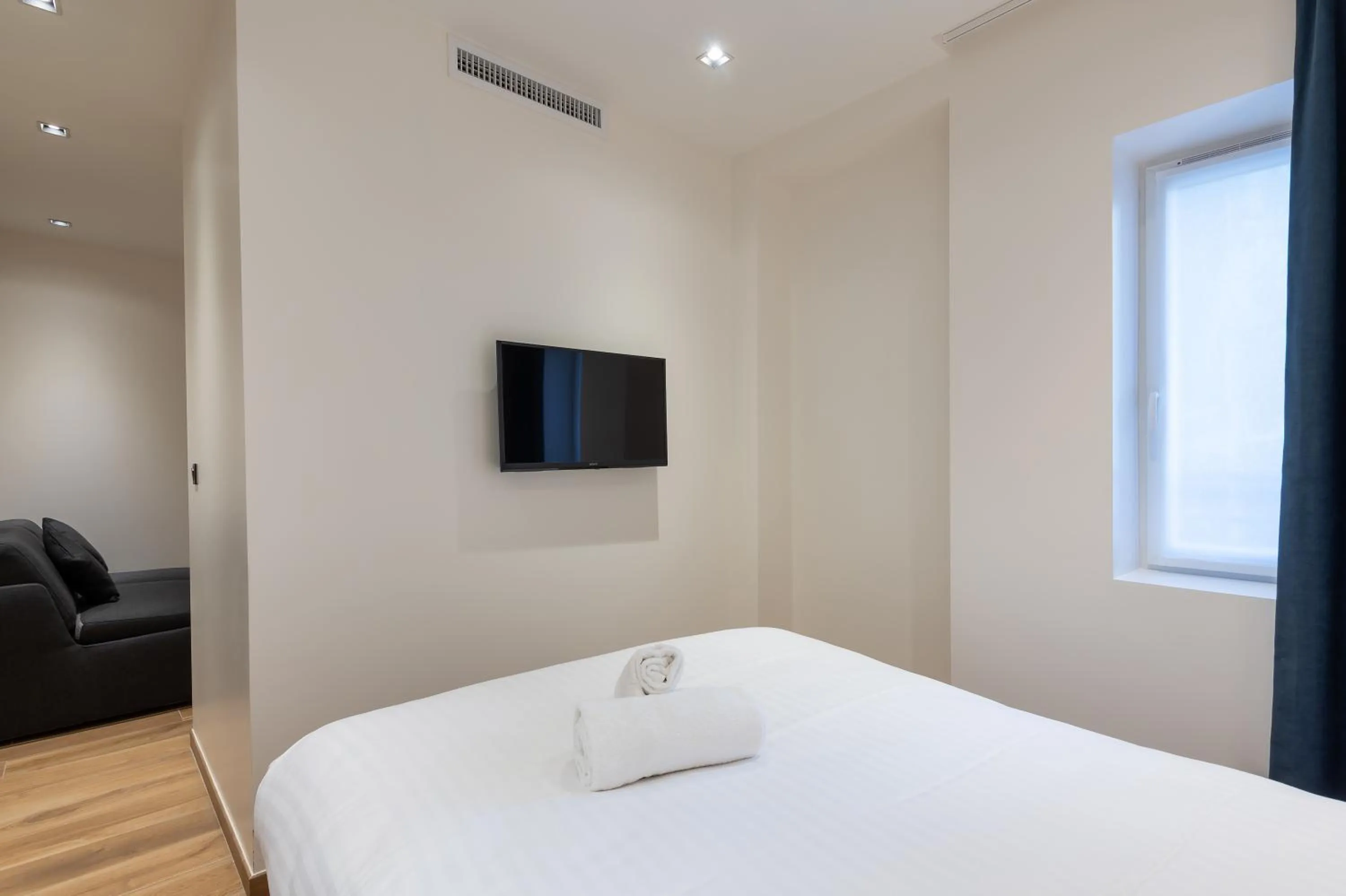 Bed in HOTEL AU COEUR DE REPUBLIQUE