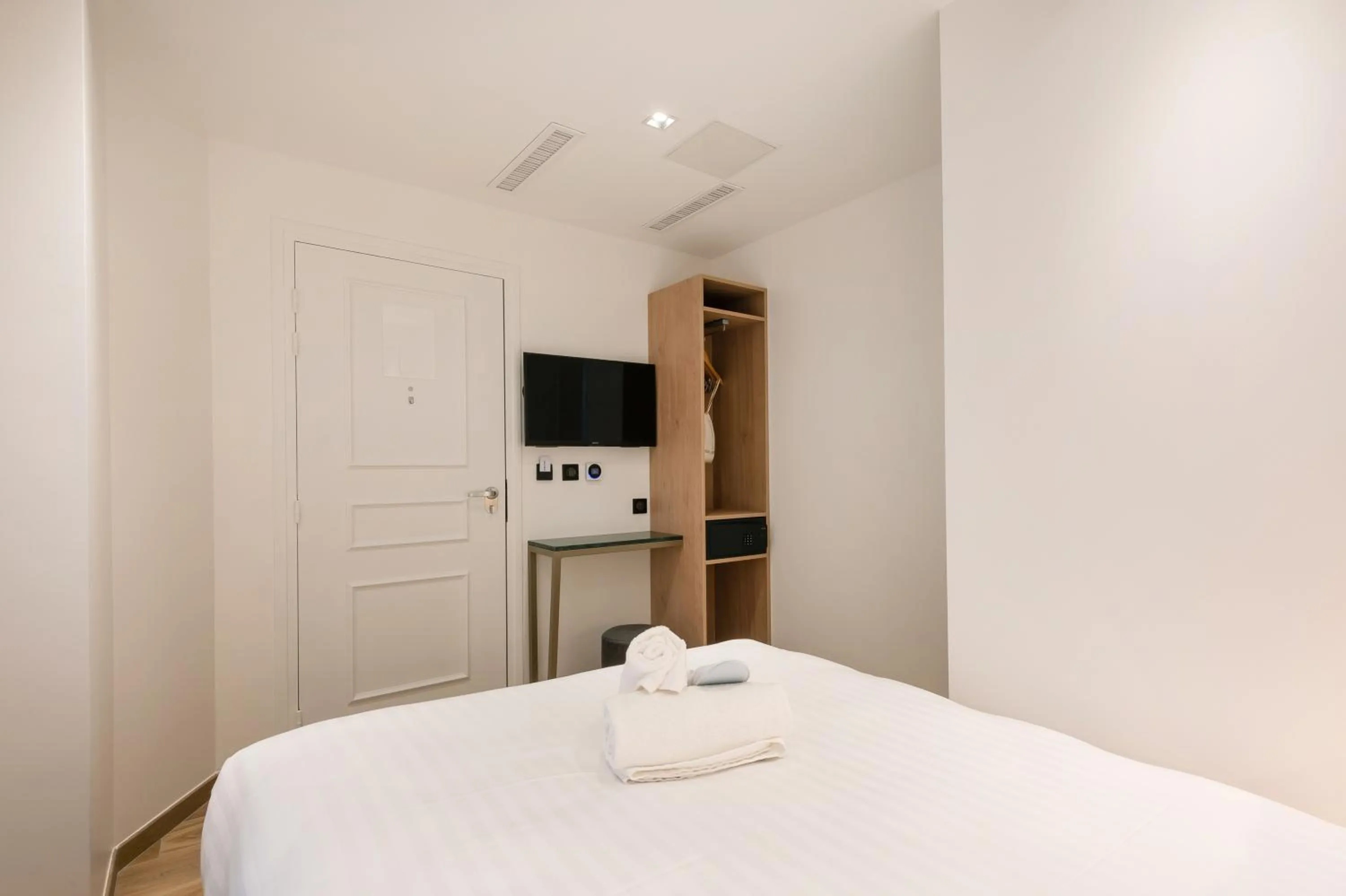 Photo of the whole room, Bed in HOTEL AU COEUR DE REPUBLIQUE