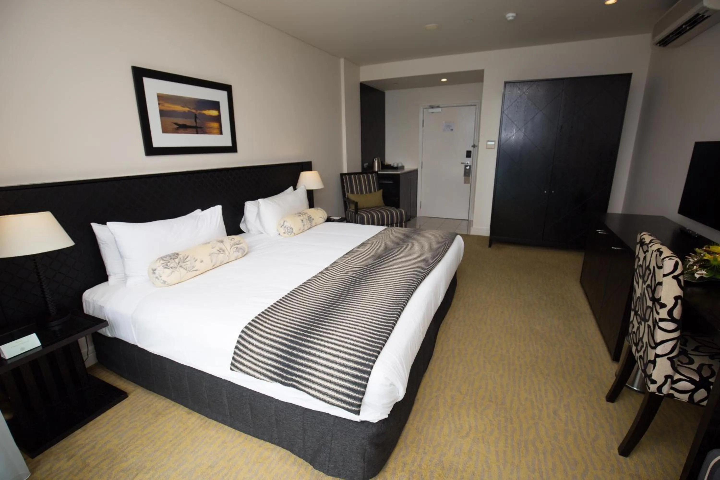 Bed in Grand Papua Hotel