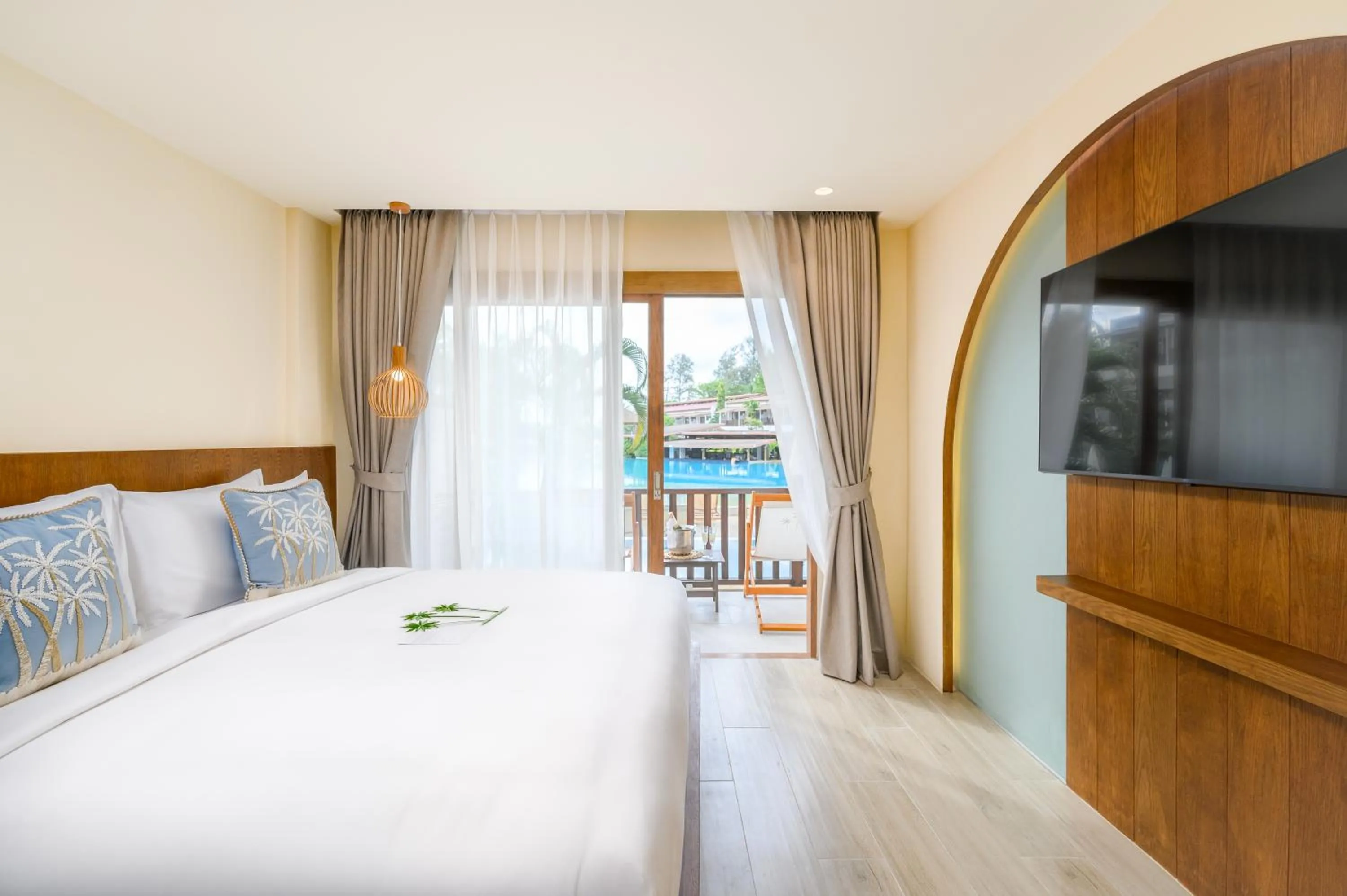 Bed in Arinara Beach Resort Phuket - SHA Extra Plus