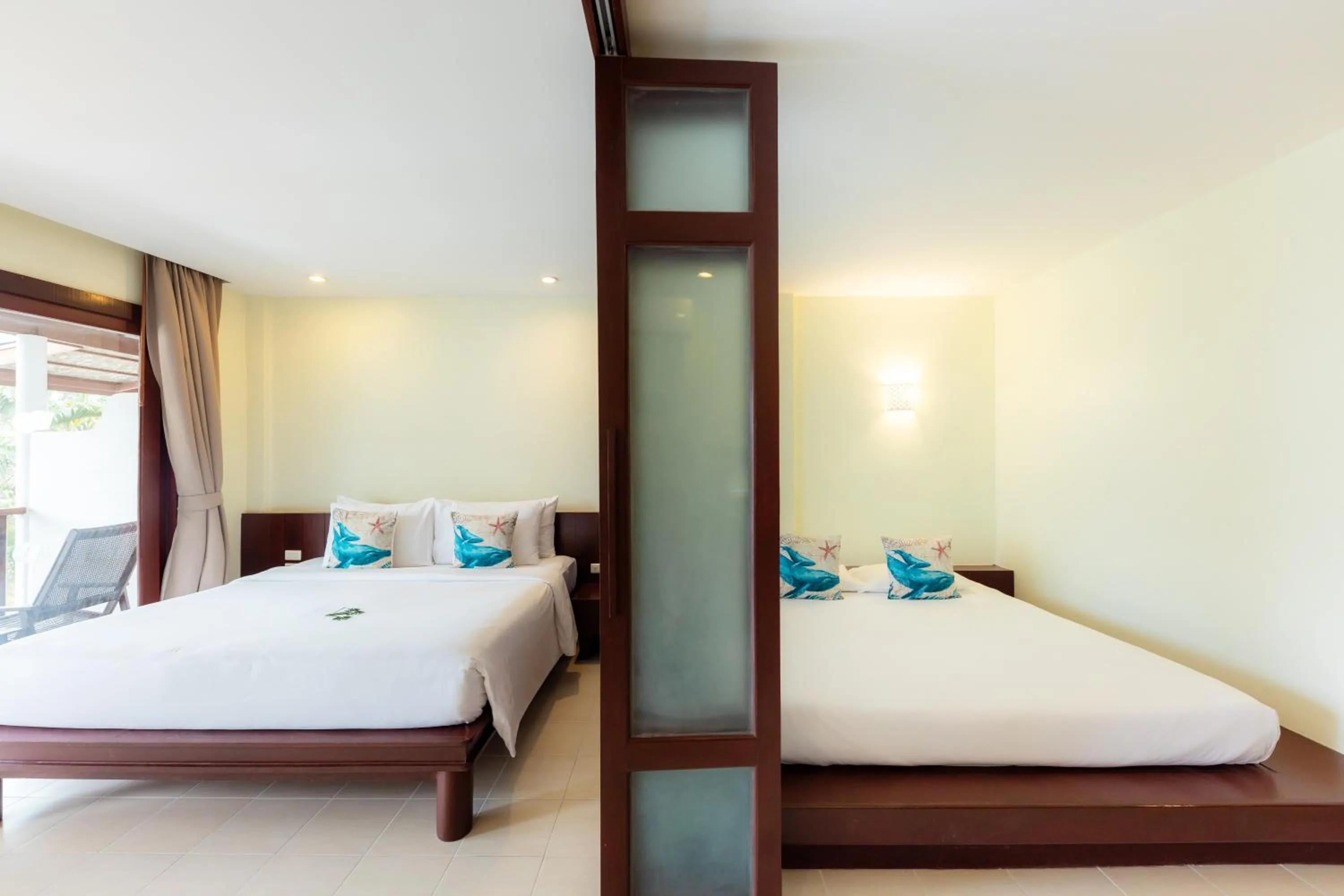 Bed in Arinara Beach Resort Phuket - SHA Extra Plus