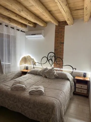 Bed in NICOLE DONEY LOCAZIONE TURISTICA