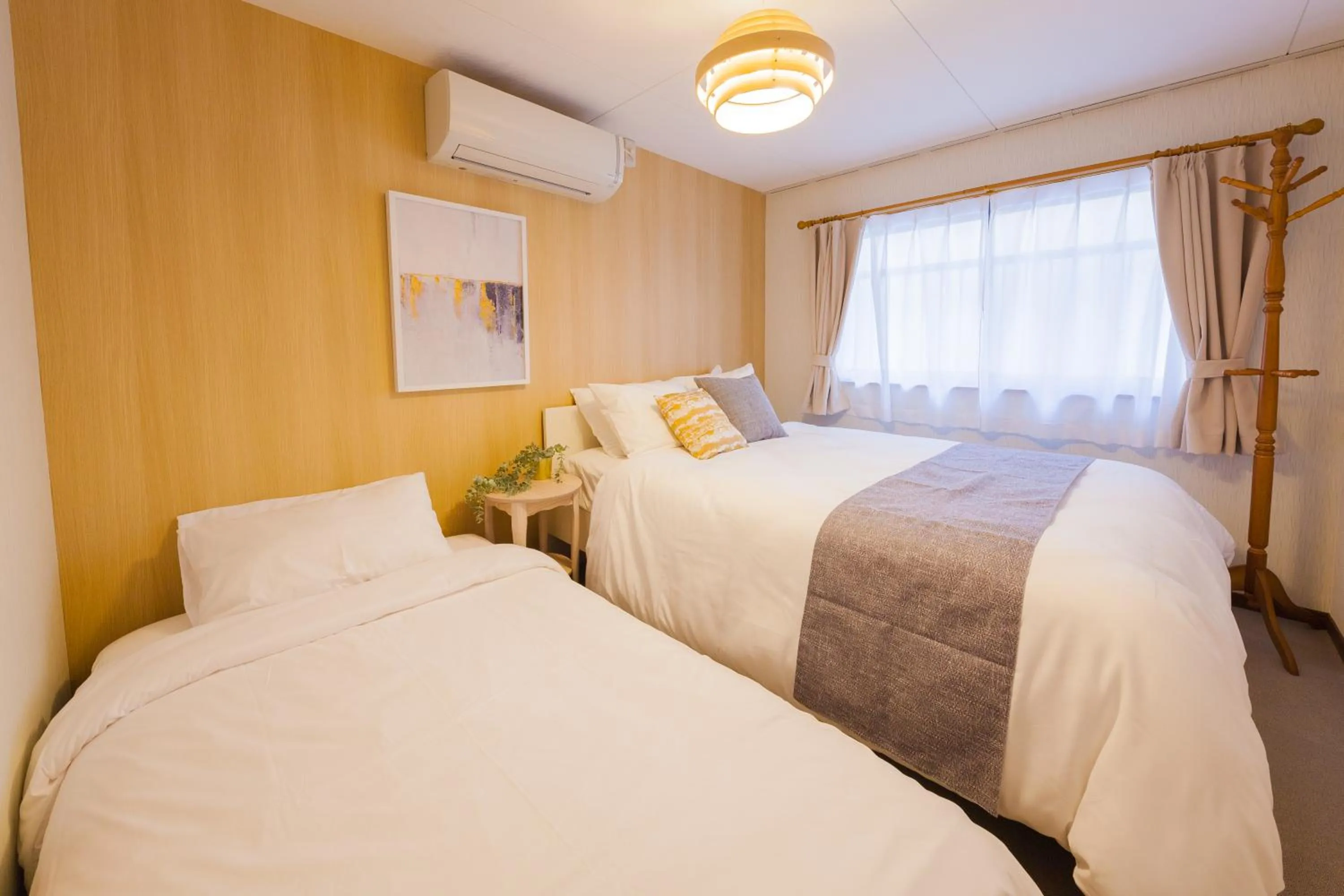 Bed in Prestige Suites Osaka Kishinosato-Tamade