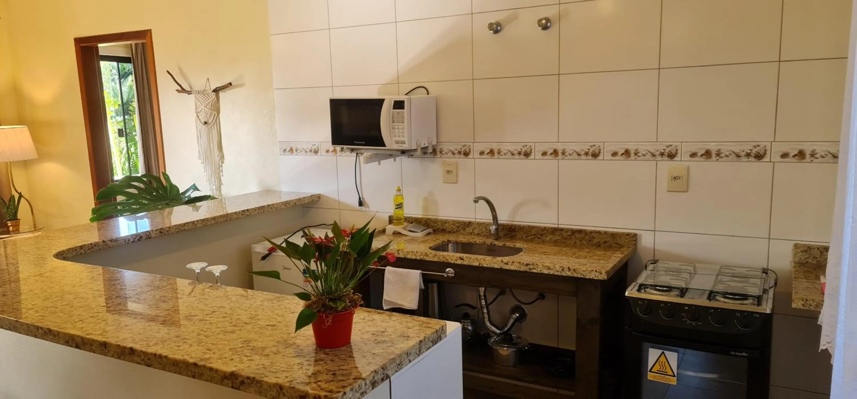 Kitchen or kitchenette in Hotel Ferrugem Eco Village