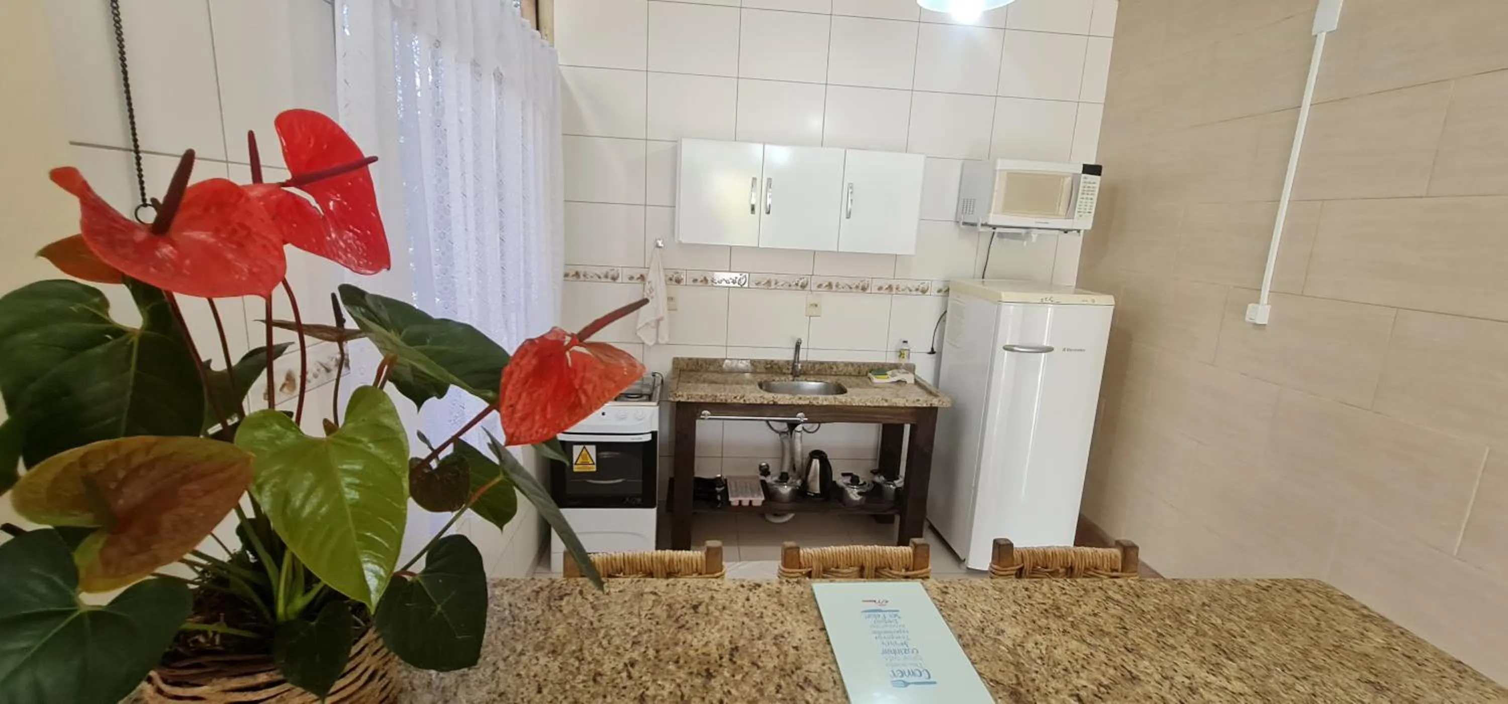 Kitchen or kitchenette in Hotel Ferrugem Eco Village