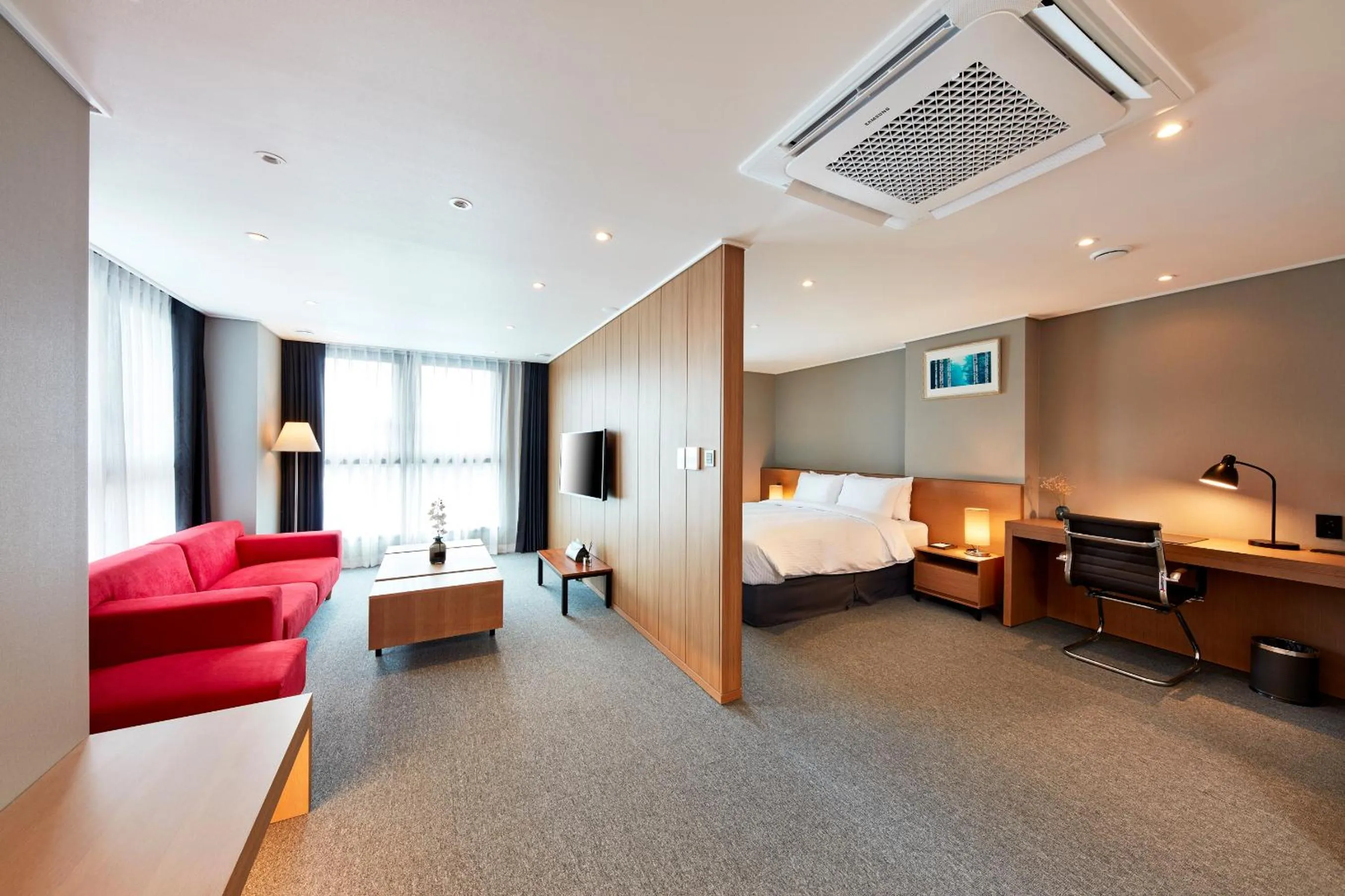 Living room, Bed in Ramada by Wyndham Gumi