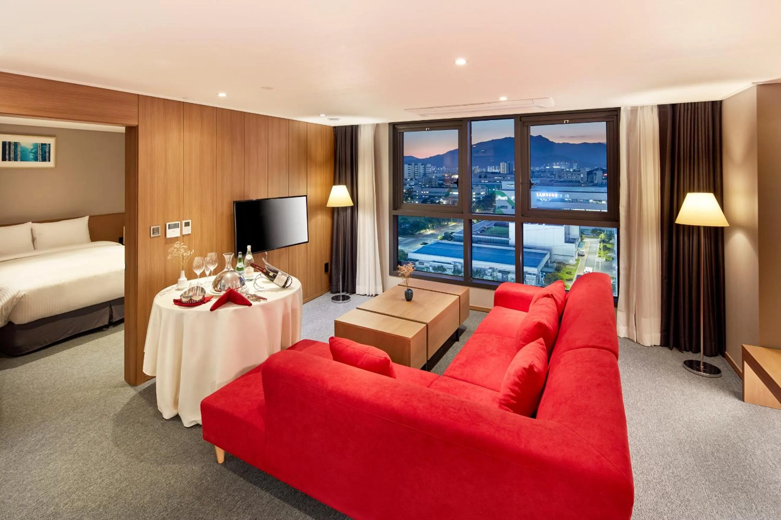 Living room, Bed in Ramada by Wyndham Gumi