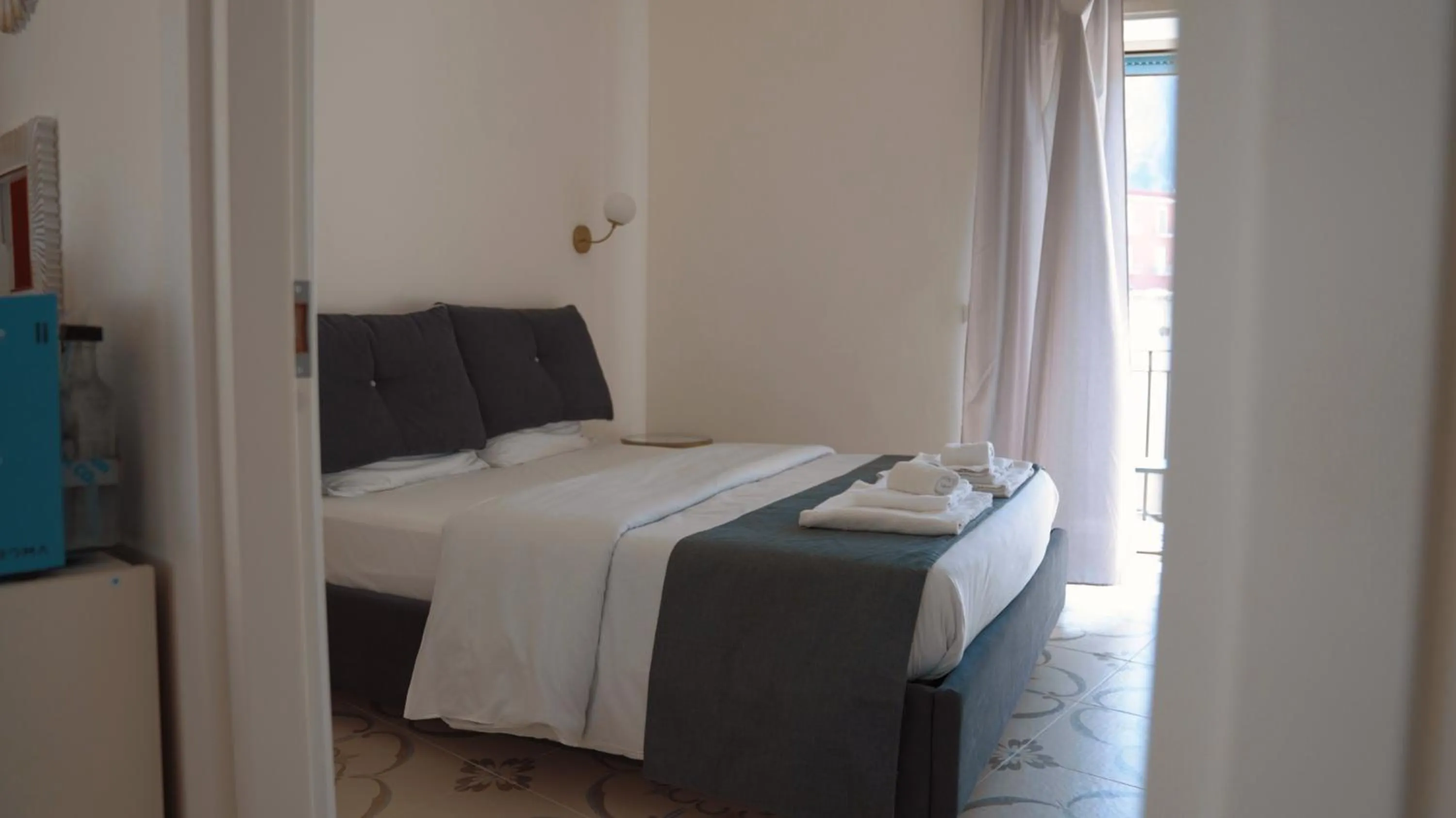 Bed in Naro Suites and Rooms