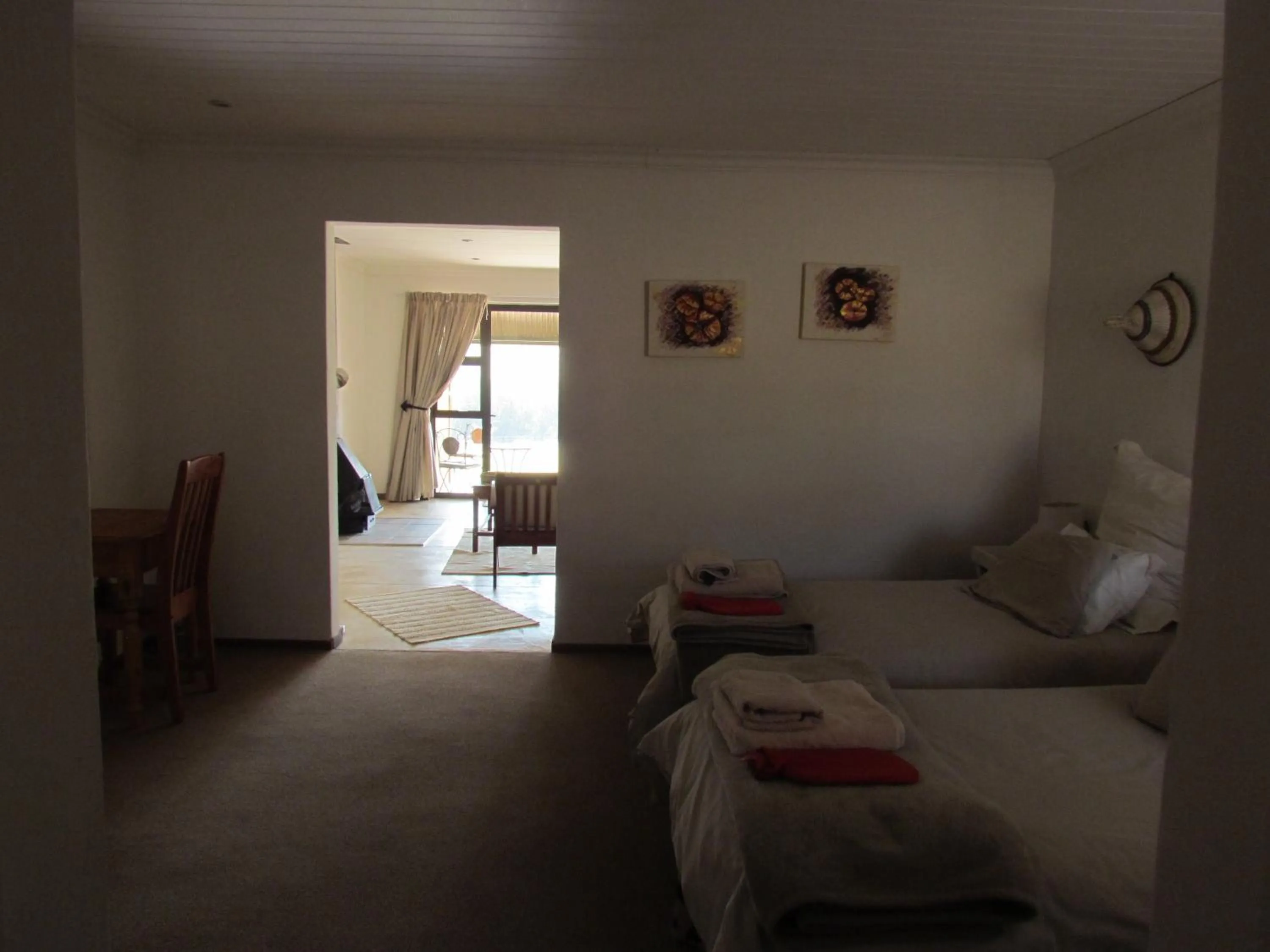 Seating area, Bed in Pumula Guest Farm
