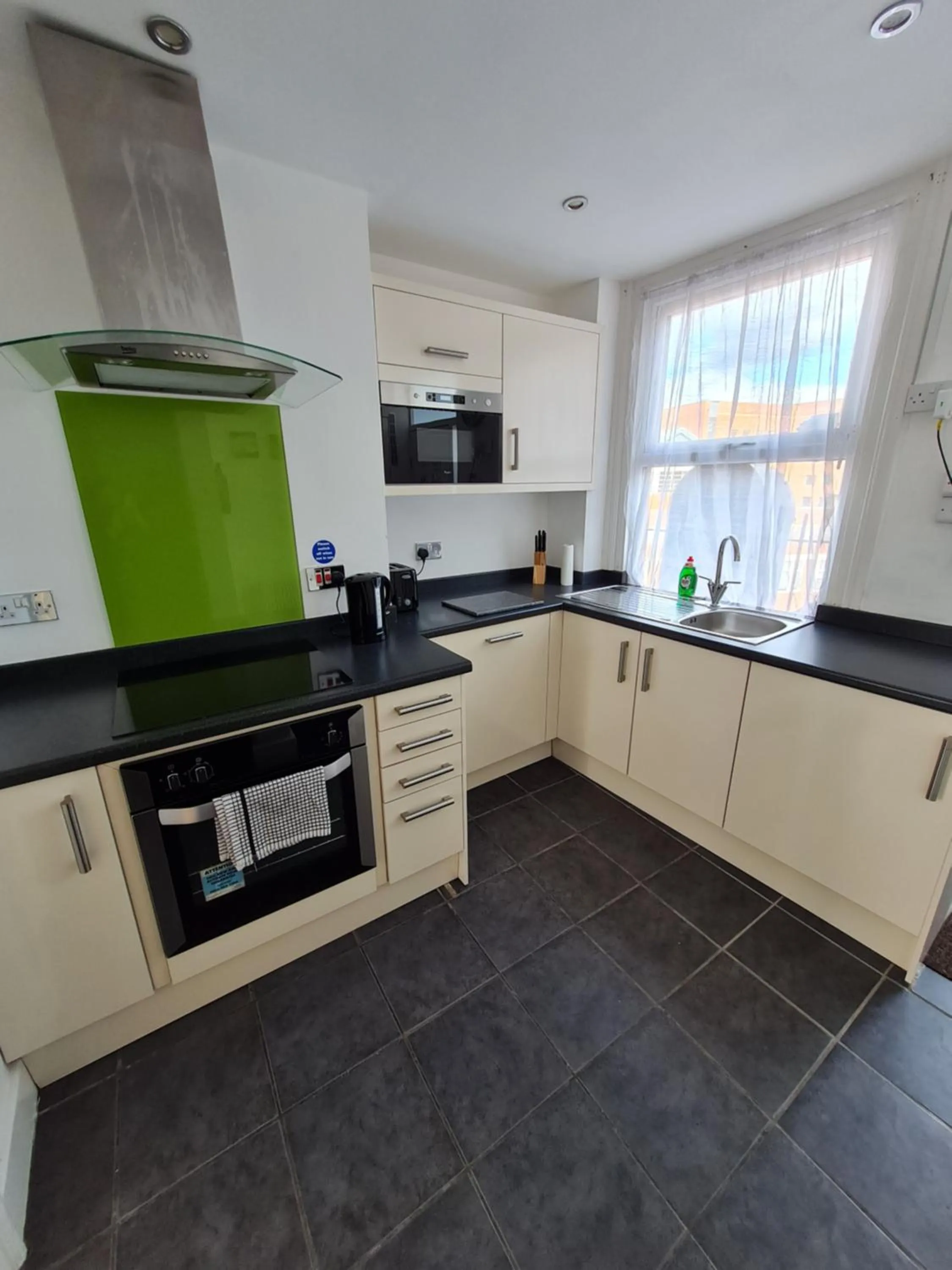 Kitchen or kitchenette in H.V Apartments