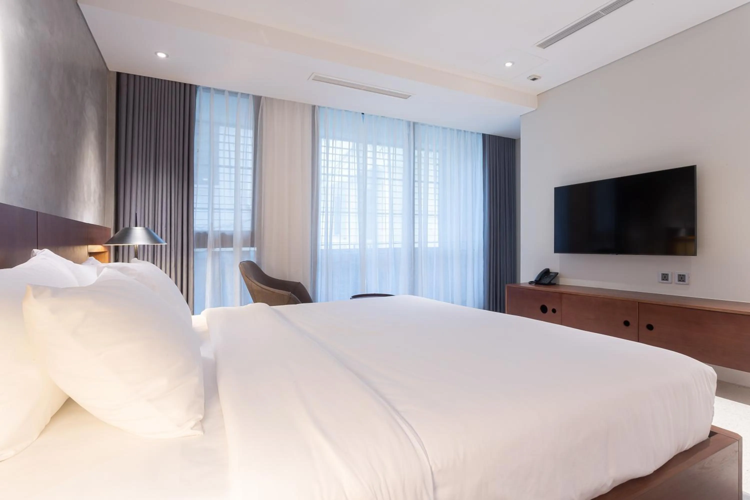 Bed in Bi Eco Suites Hanoi