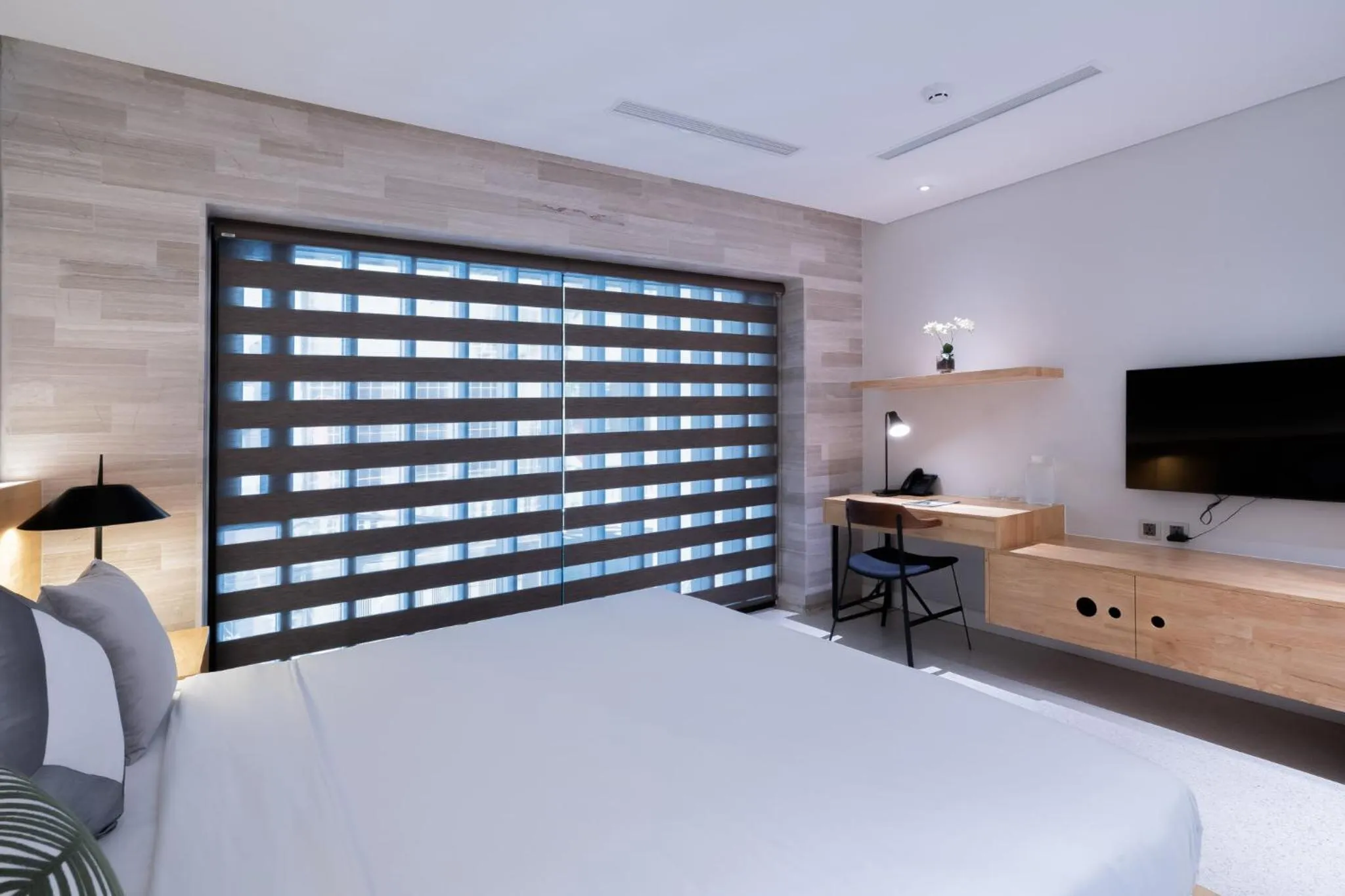 Bed in Bi Eco Suites Hanoi