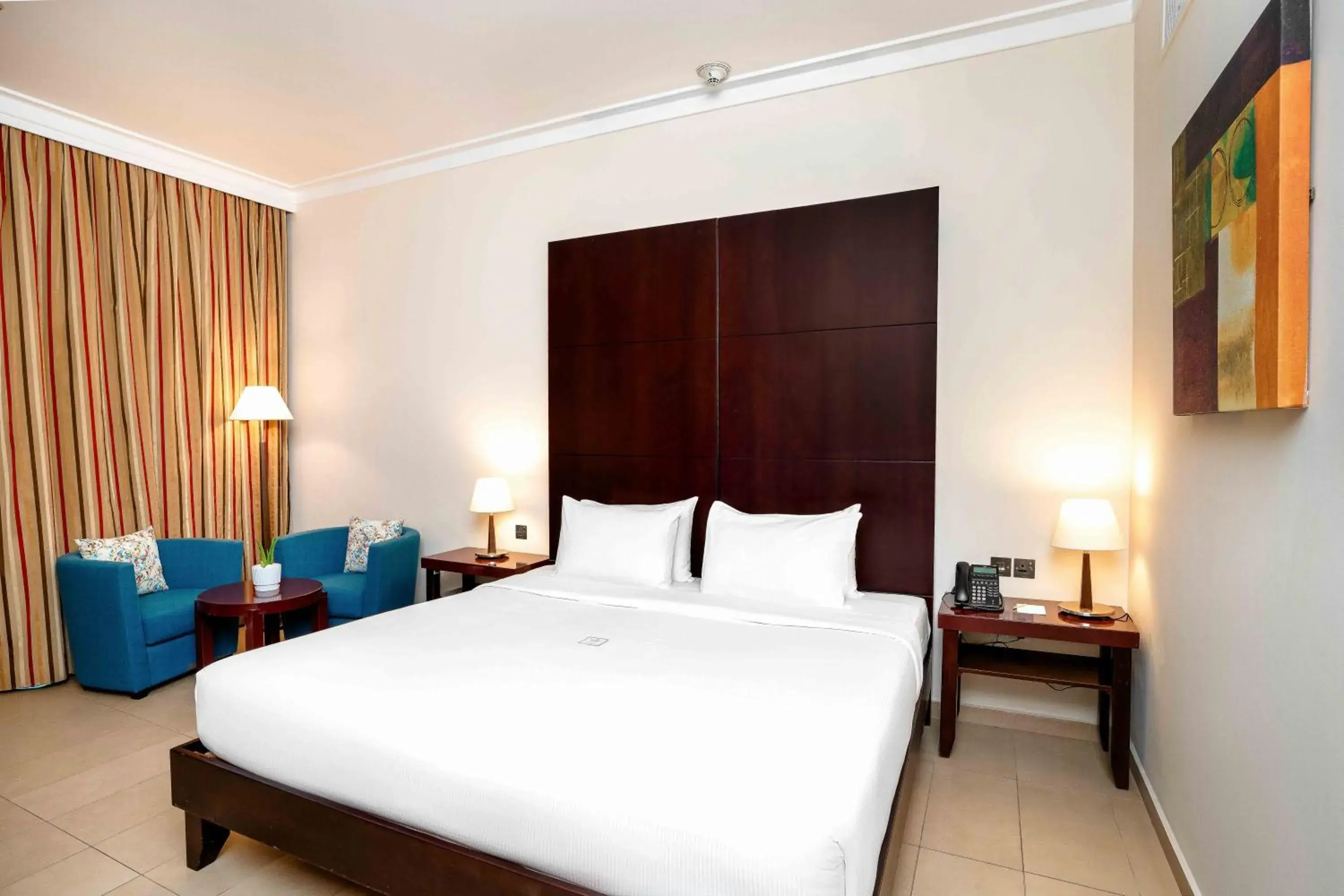 Deluxe Room Pool View with One King Bed - single occupancy in Metropolitan Al Mafraq Hotel Deluxe Room Pool View with One King Bed - single occupancy in Metropolitan Al Mafraq Hotel