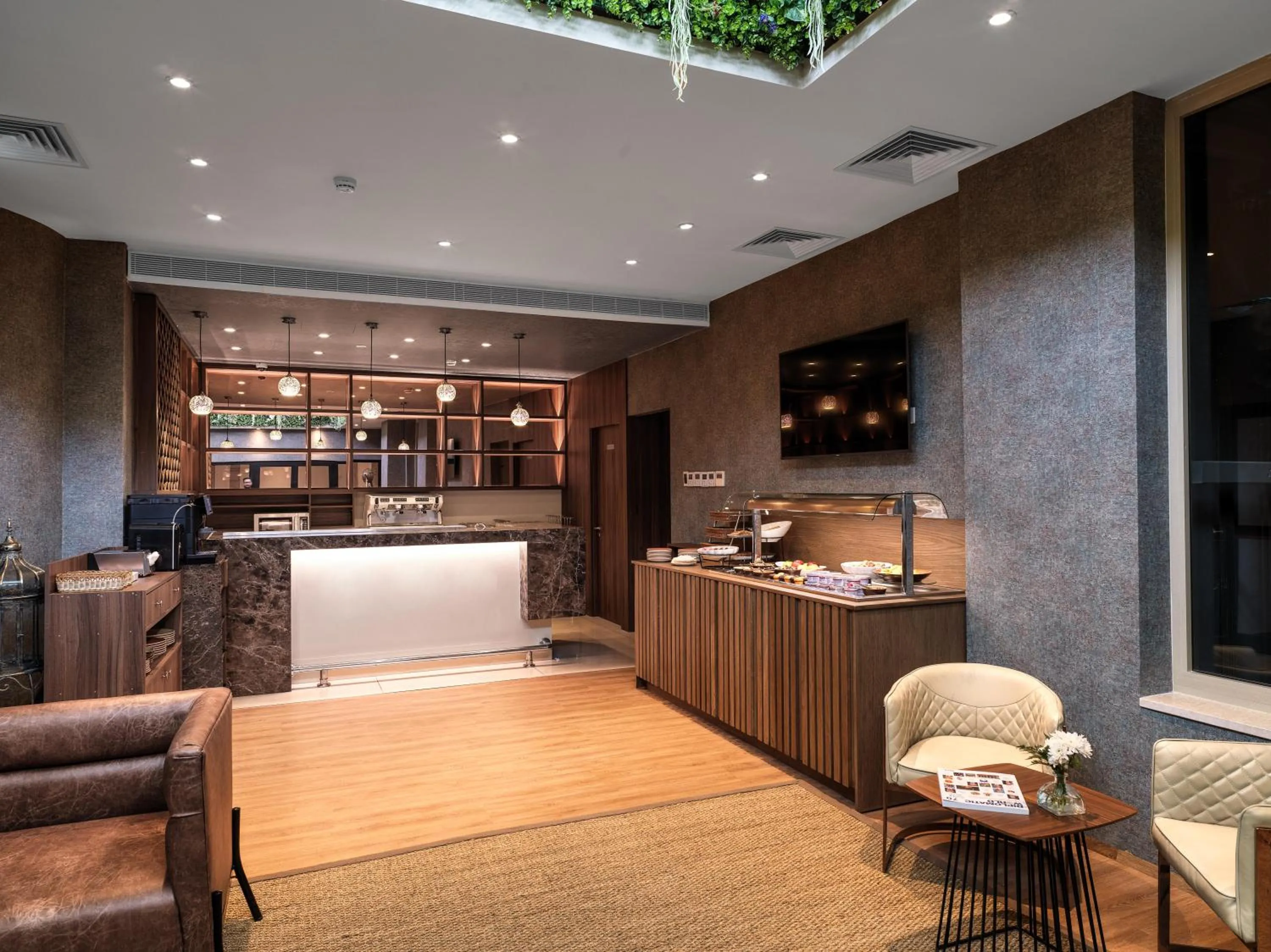 Communal lounge/ TV room in Leonardo Boutique Hotel Larnaca