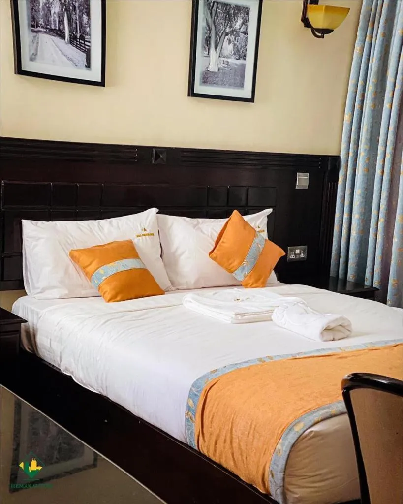 Bed in Hemak Suites