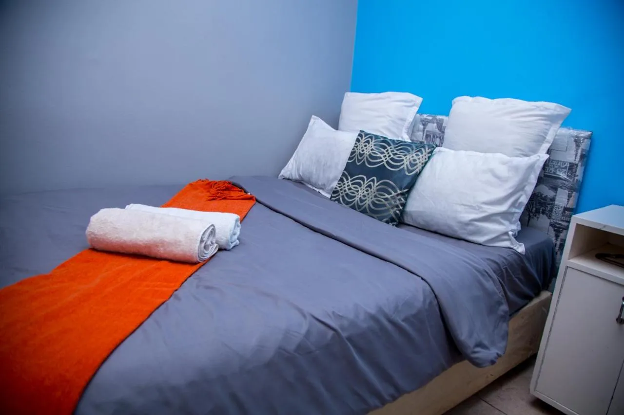 Bed in Relaxing Guest House in th Heart of Ndabeni