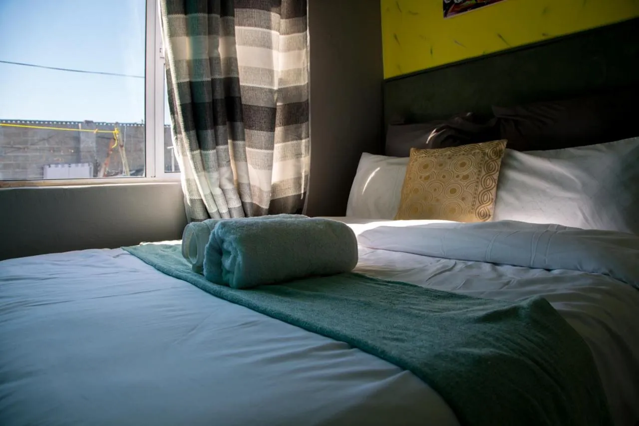 Bed in Relaxing Guest House in th Heart of Ndabeni