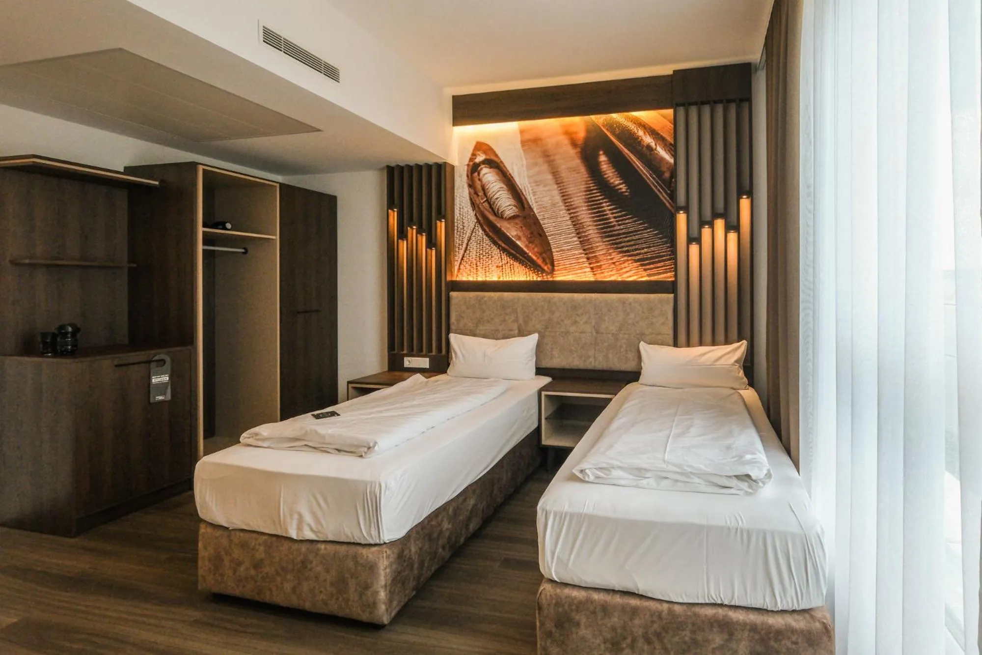 Photo of the whole room, Bed in Tools Hotel Laichingen