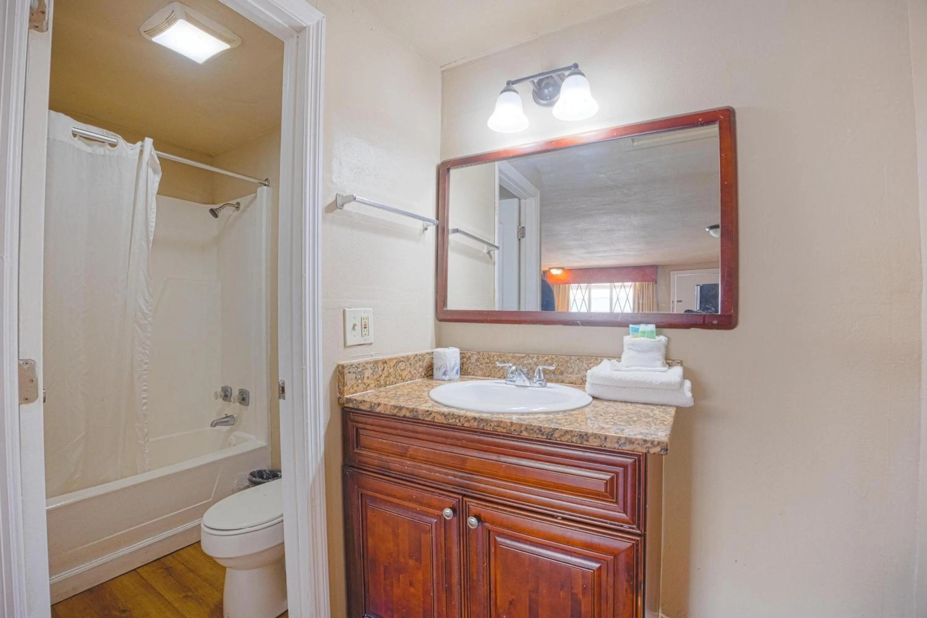Bathroom in Liberty Garden Inn by OYO Kissimmee near Disney World
