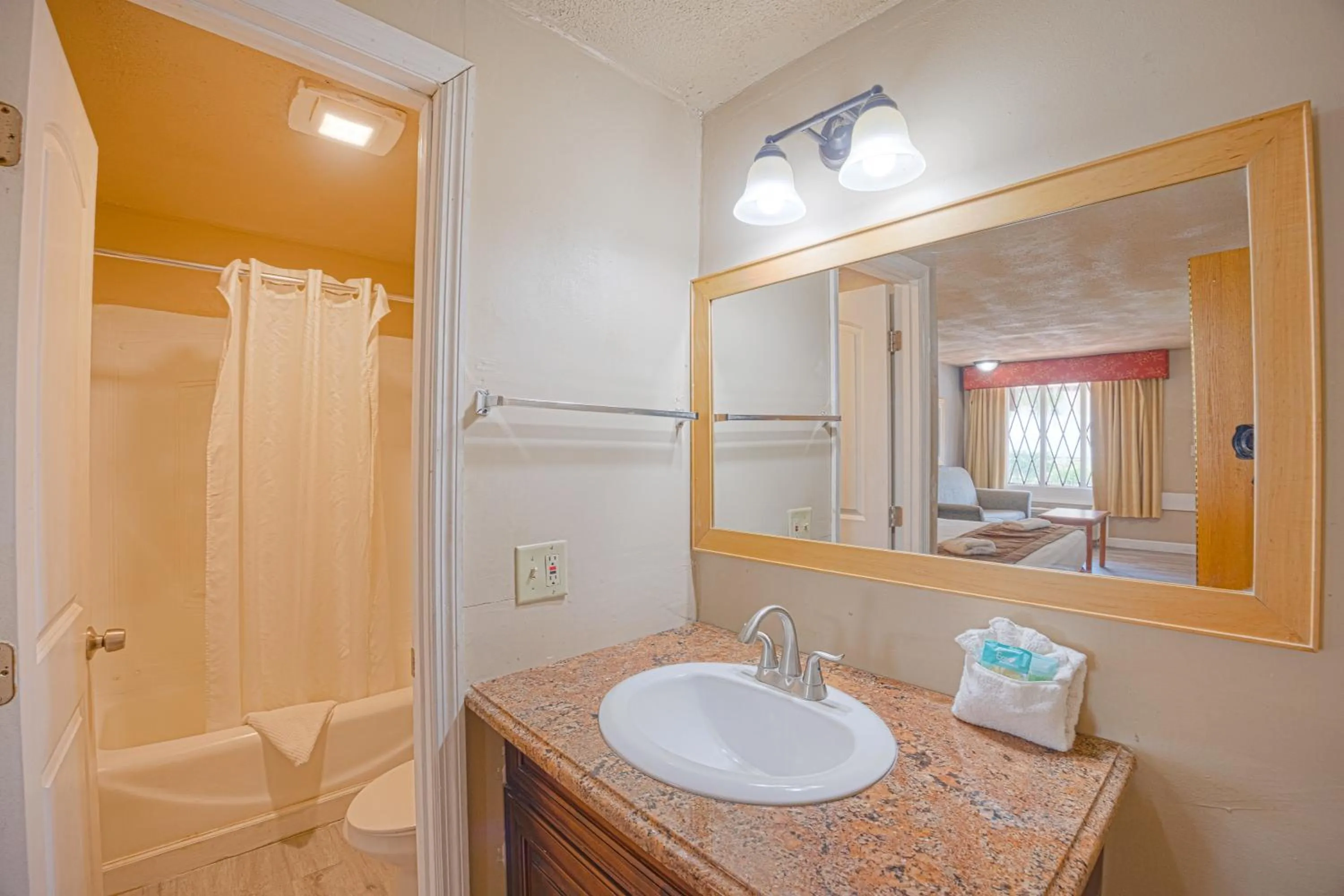 Bathroom in Liberty Garden Inn by OYO Kissimmee near Disney World