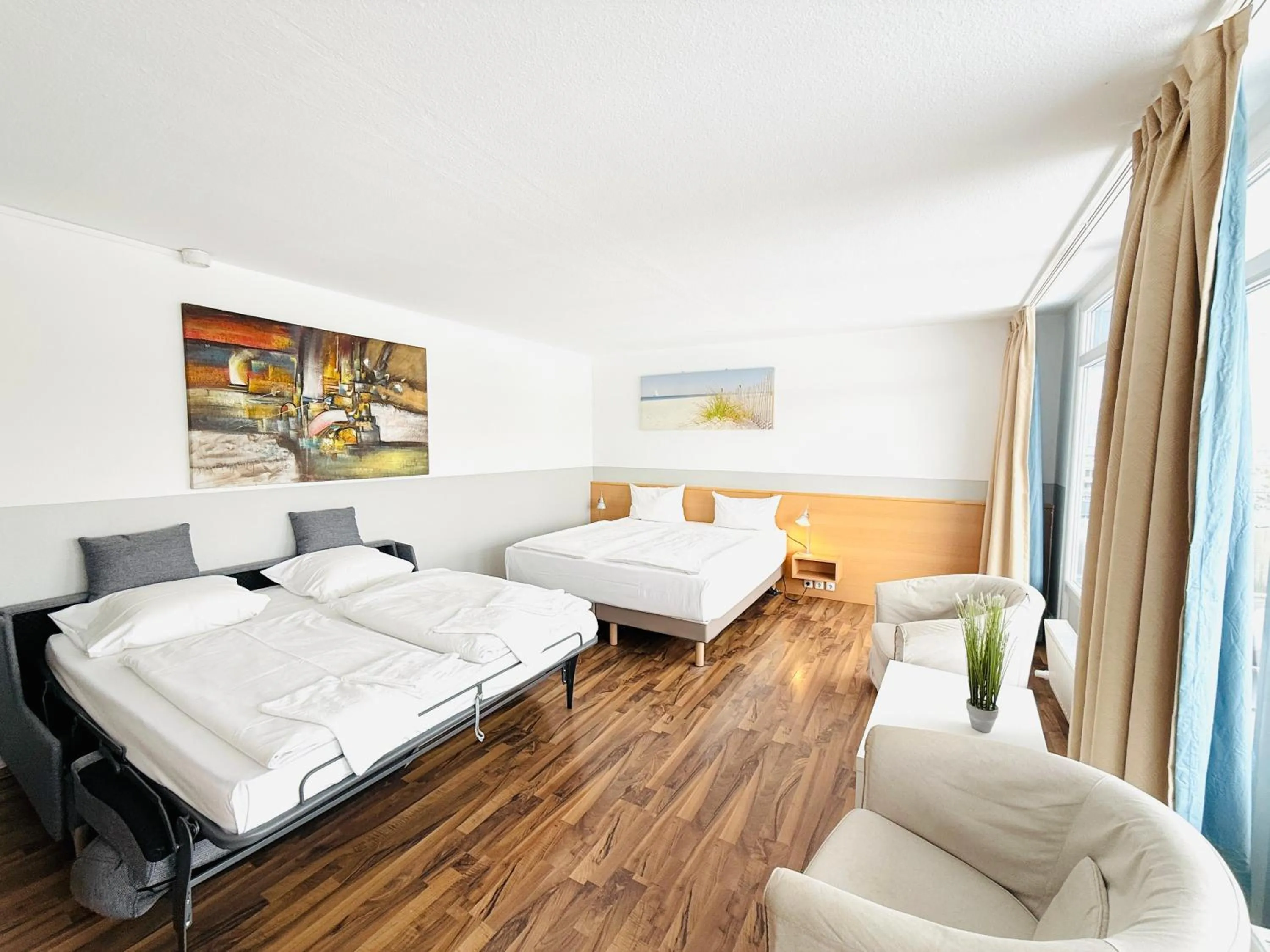 Photo of the whole room, Bed in Hotel Plöner See by Tulip Inn